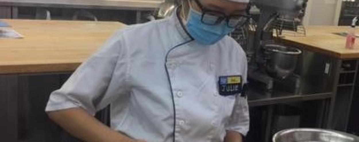 Masked baking student in lab