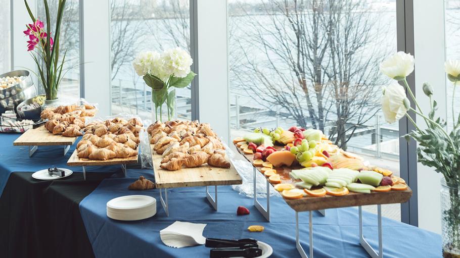 A catering spread on a table at 51 Dockside Dr., Waterfront Campus
