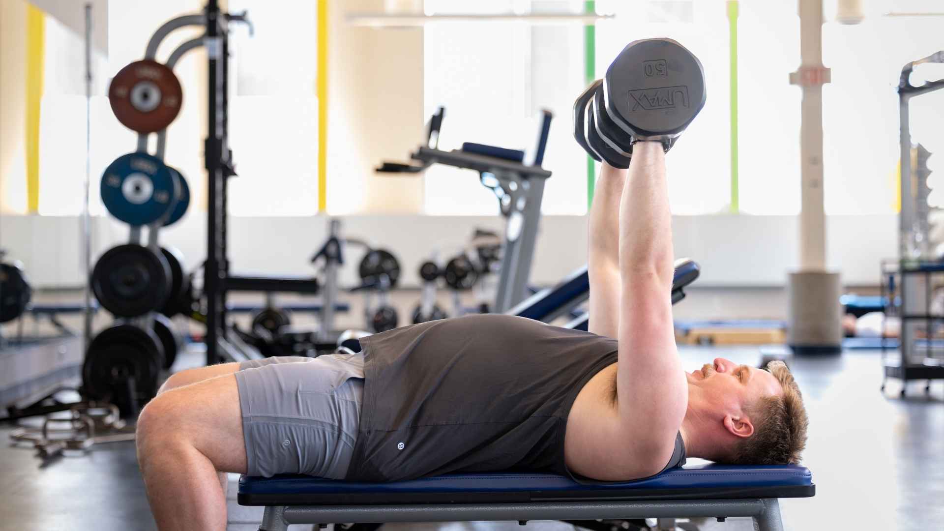 A student lifts weights.