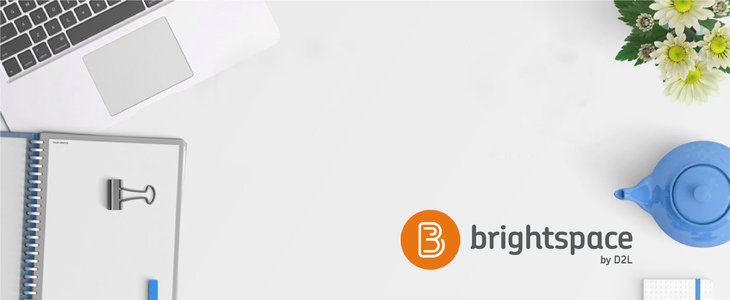 An aerial shot of items on a desk like notebook and laptop. The D2L Brightspace logo is in the bottom right corner.