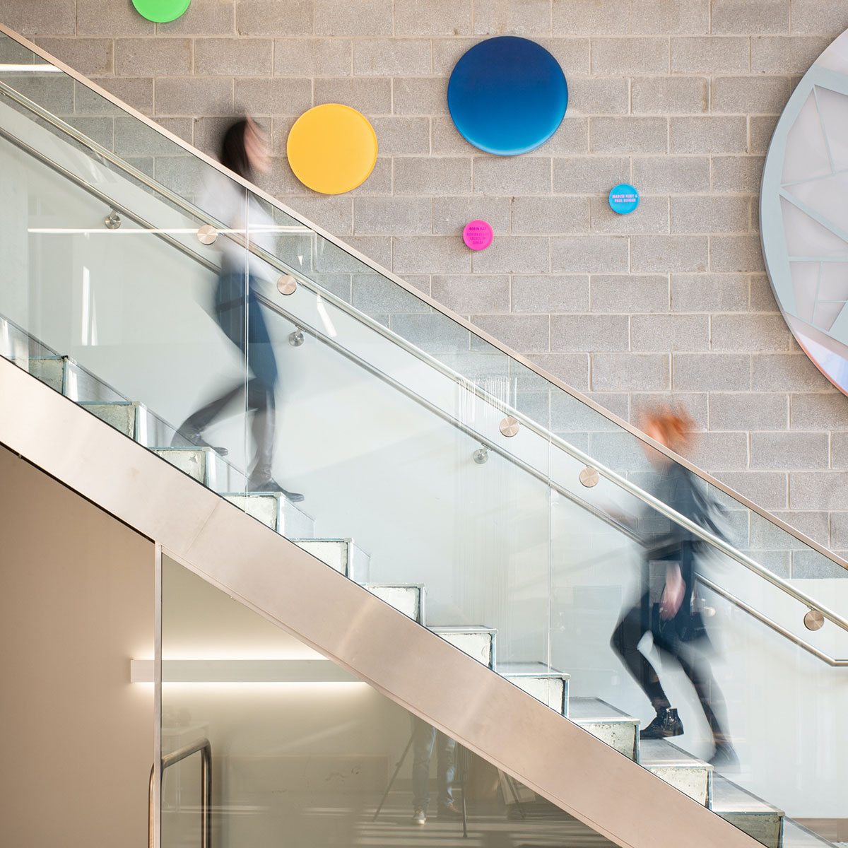 Students use the stairs at the School of Design.