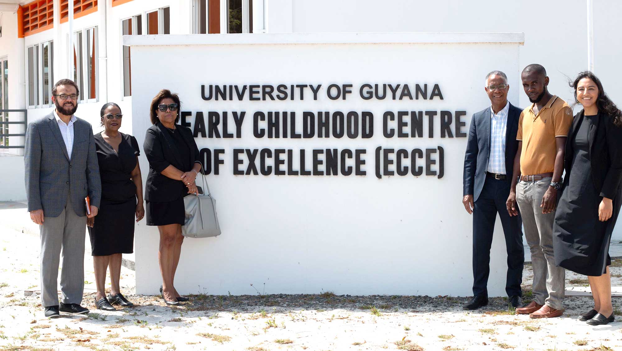 GBC delegation standing in front of University of Guyana Early Childhood Centre of Excellence