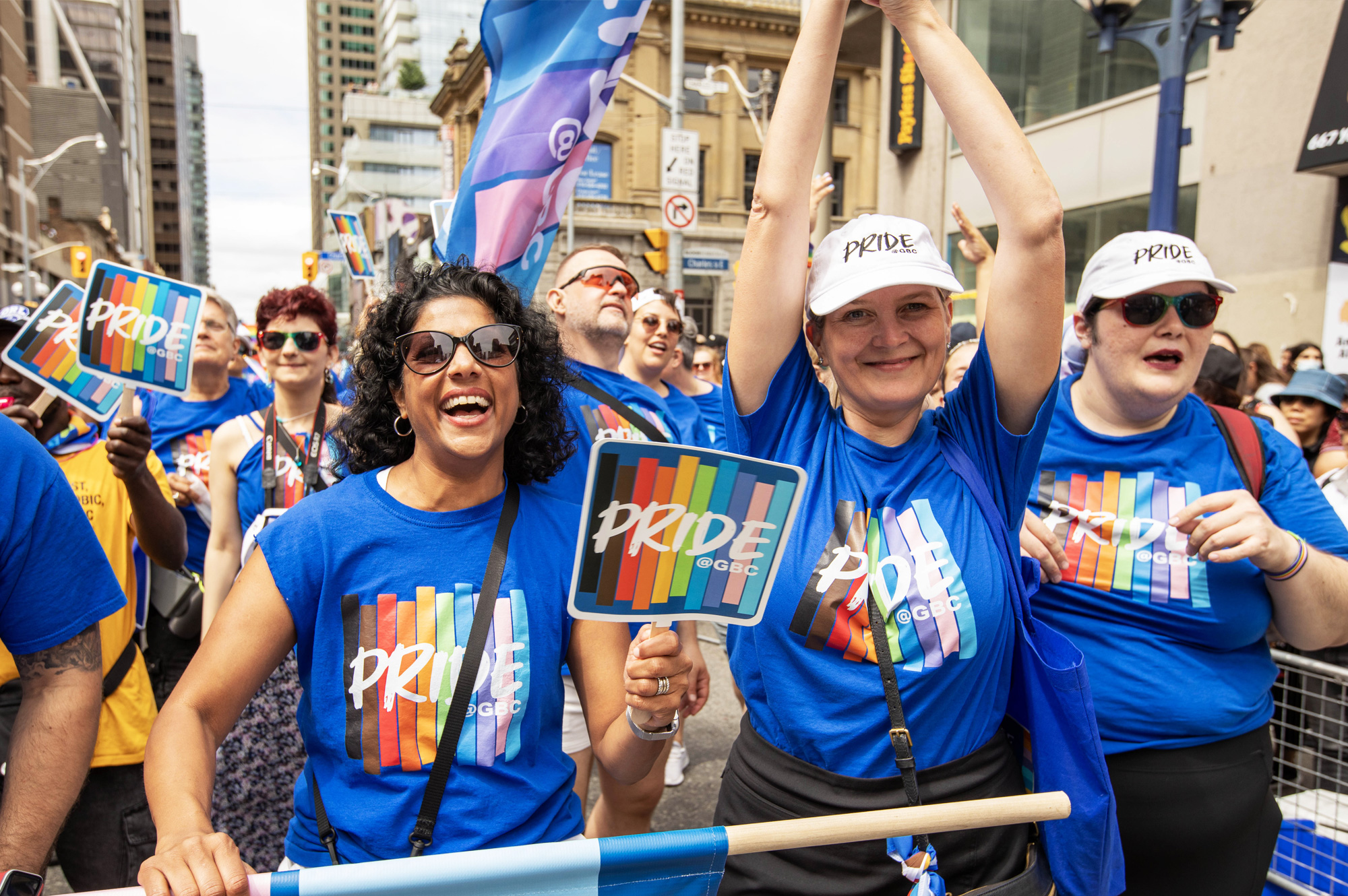 A group of people march in a pride parade