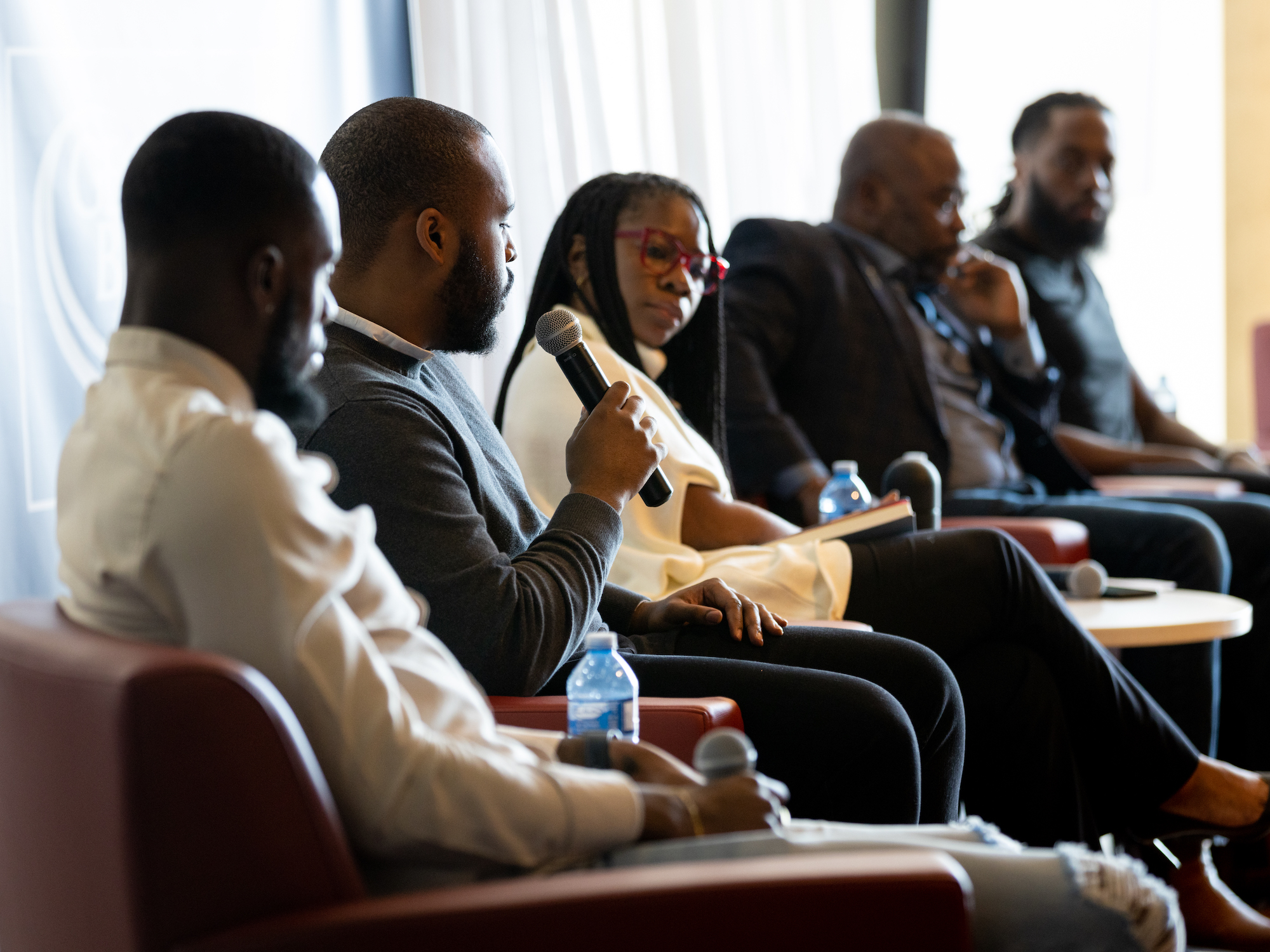 Internal and external speakers participate in a panel discussion on fostering Black excellence every day. 