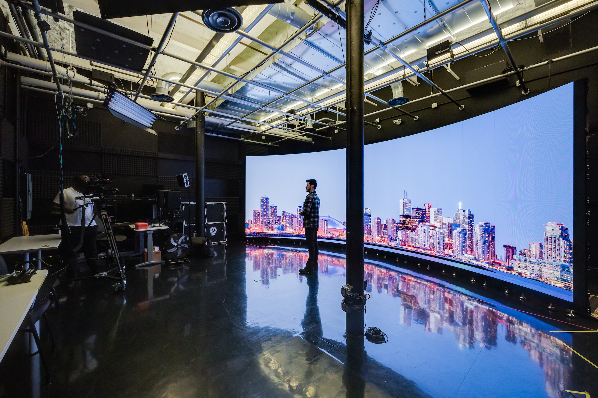 Students from the School of Media & Performing Arts work in the LED media wall studio.