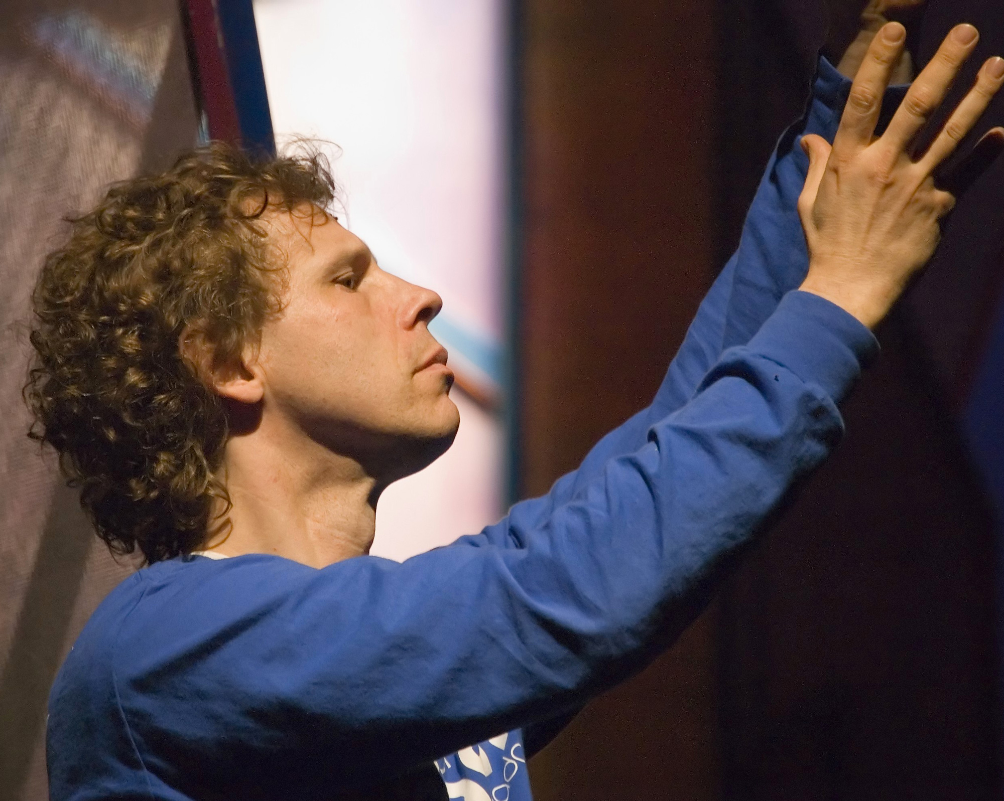 Bengt Jorgen with arms outstretched as he guides a performance