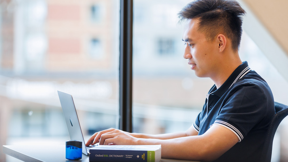 Student working at the laptop