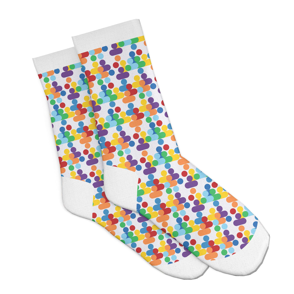 A pair of white socks with a bright colourful repeated pattern against a white background