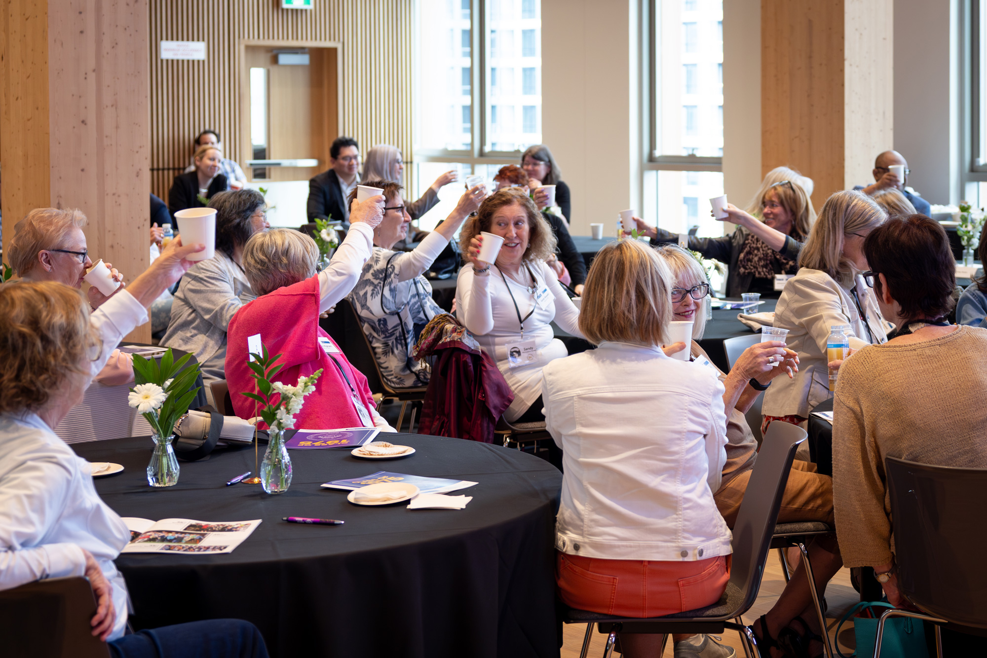 A group of alumni nurses toast their 50th nursing reunion at George Brown College