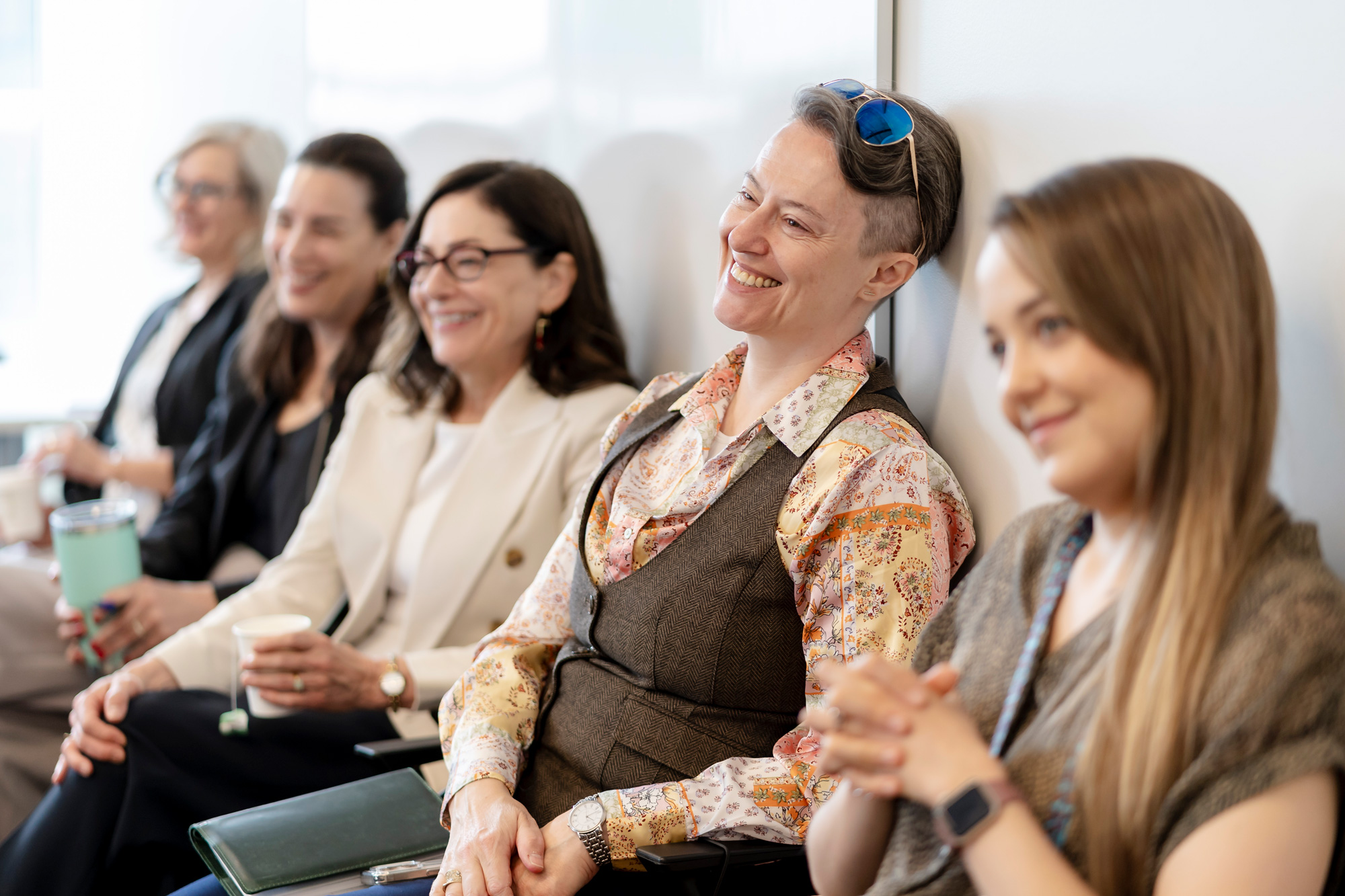 Delegates at the Pedagogies of Global Togetherness smile as presenters share their stories