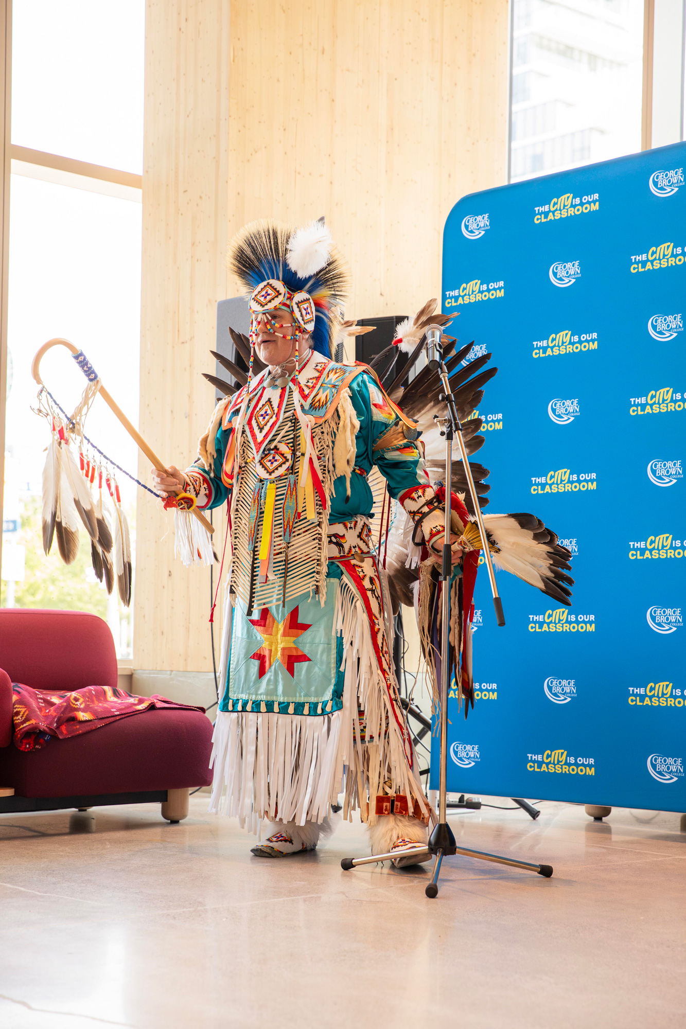 An elder from the Mississaugas of the Credit First Nation explains the background on a dance