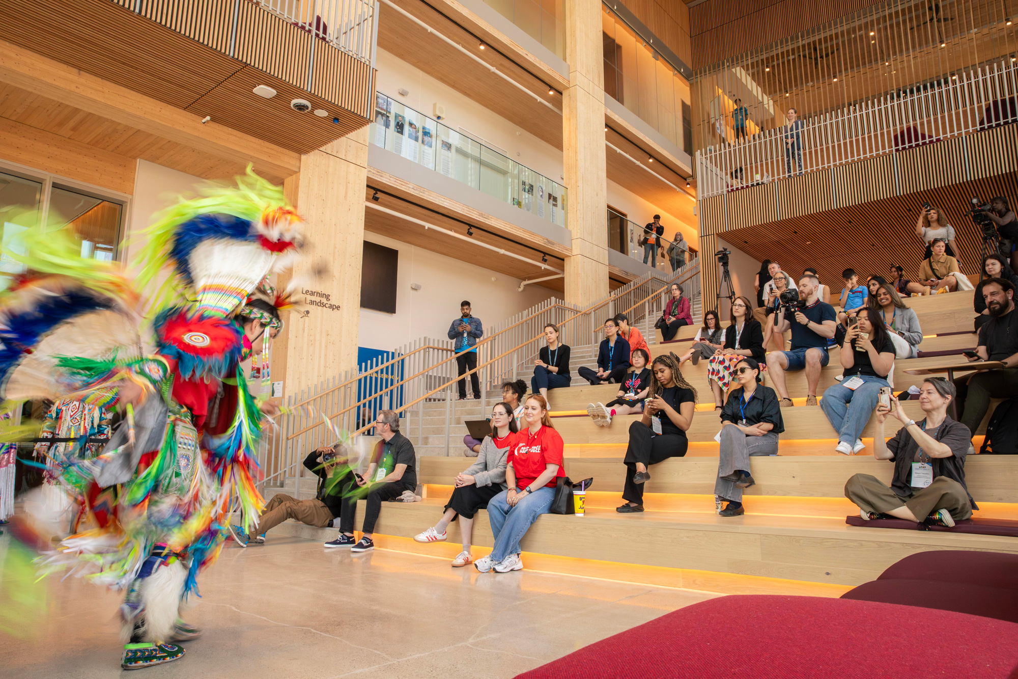 A man from the Mississaugas of the Credit First Nation dances a fancy dance in traditional clothing
