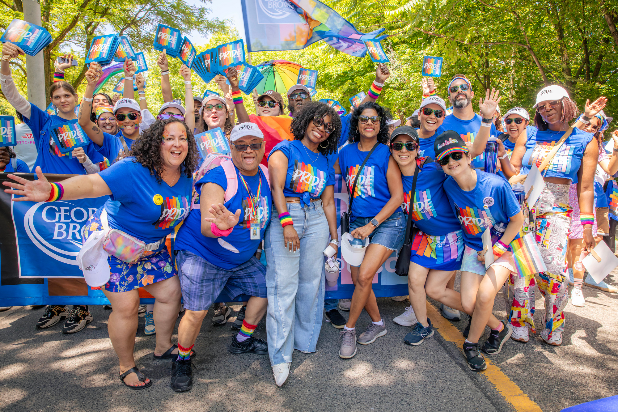 GBC students and staff pose as a group in bright blue Pride at GBC t-shirts