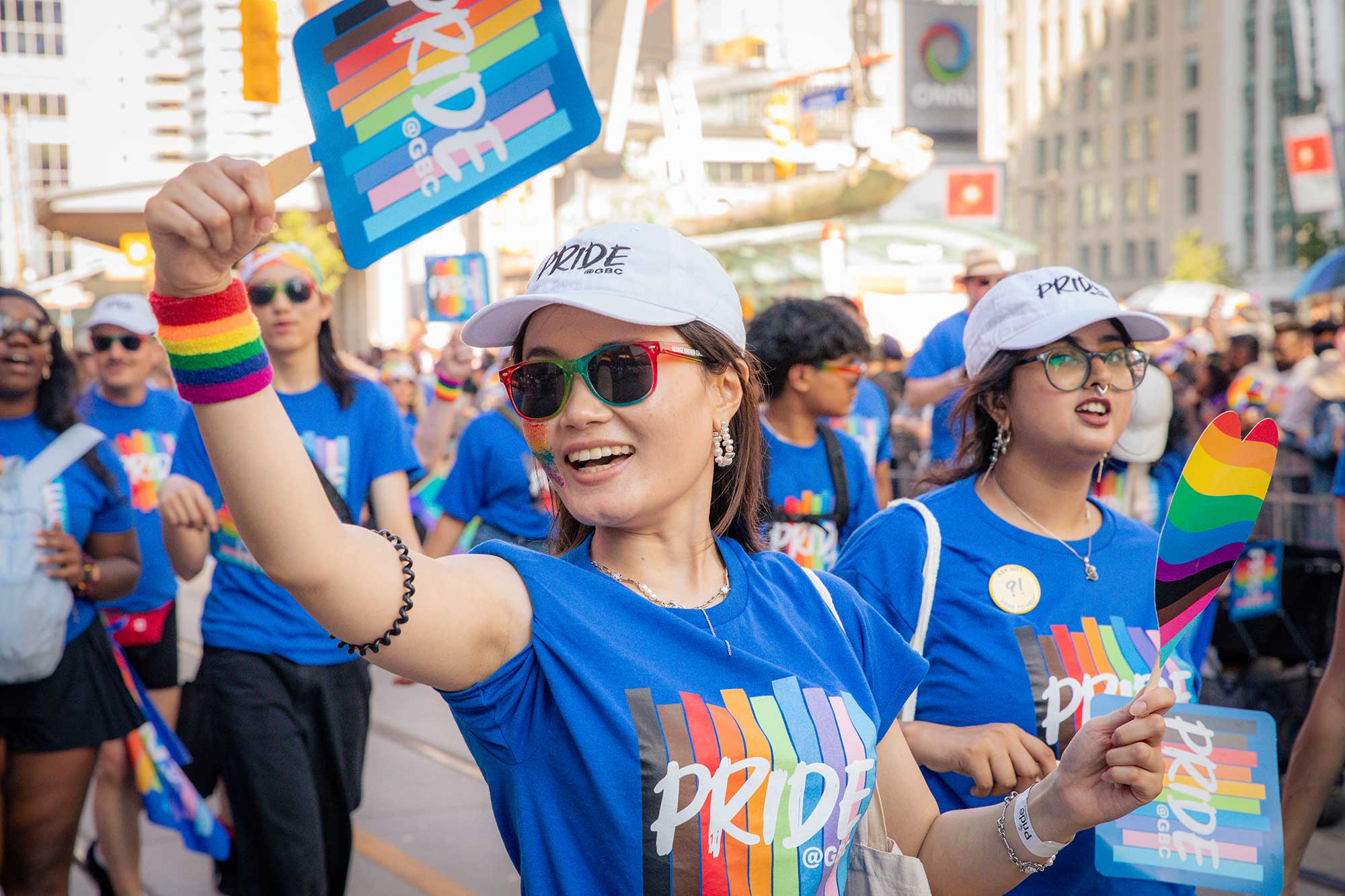 Pride marcher holding up Pride@GBC sign