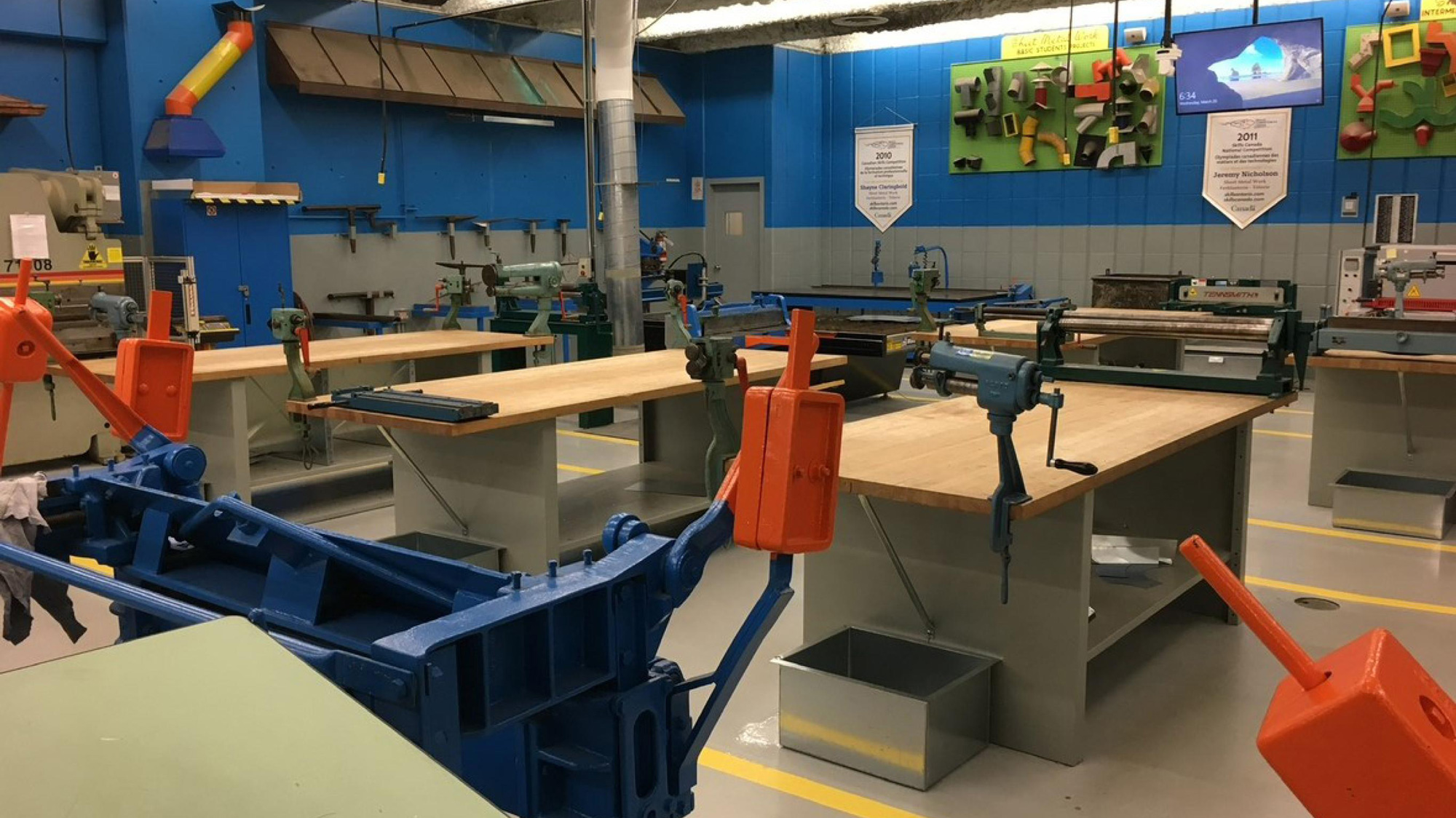 Sheet metal shop with tools and vents for training Red Seal Sheet Metal Worker students in fabrication and repair.