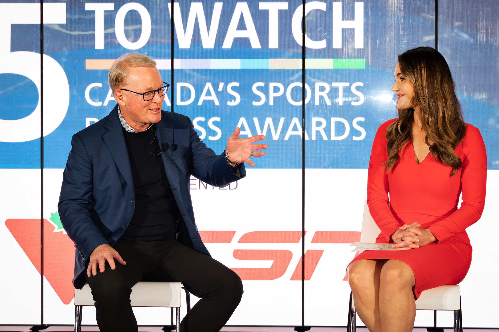 Keith Pelley sits on stage at the 5 to Watch event chatting with the host
