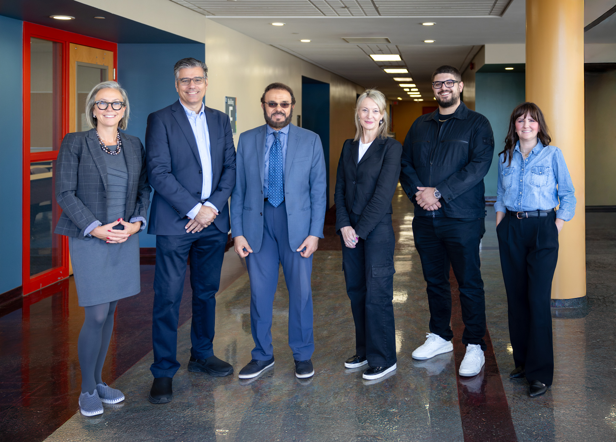 George Brown staff and Tridel's Norbert Dacosta stand inside George Brown's Casa Loma campus for the BOLT Day of Discovery