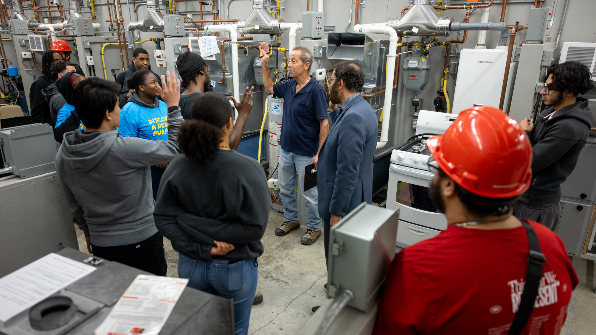 A group of students tour the HVAC lab