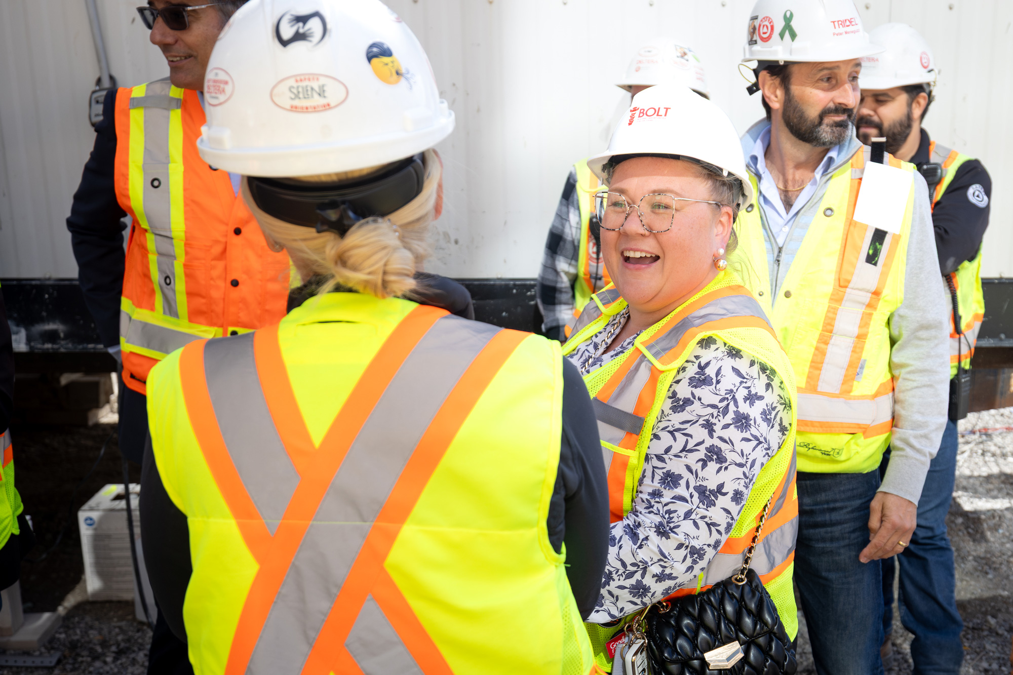 Members from Tridel welcome students to a construction site