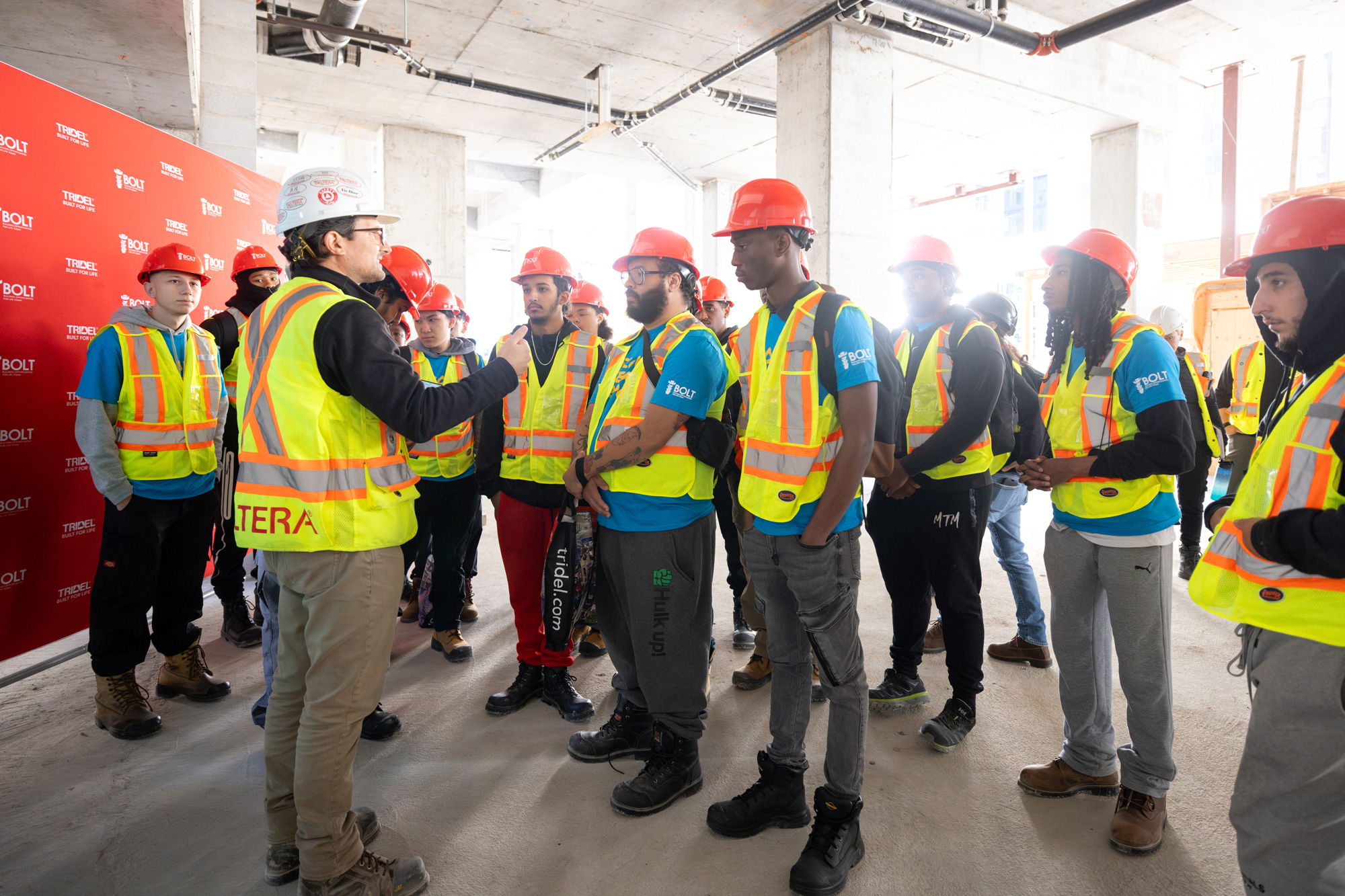 Members from Tridel welcome students to a construction site