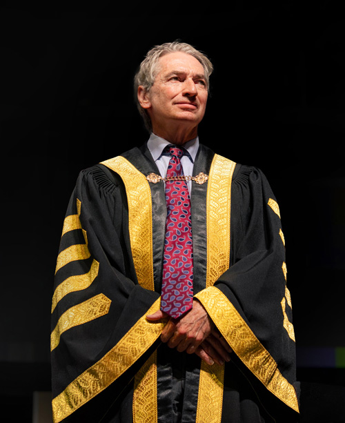 Geoff Smith in gold and black Chancellor robes at convocation ceremonies