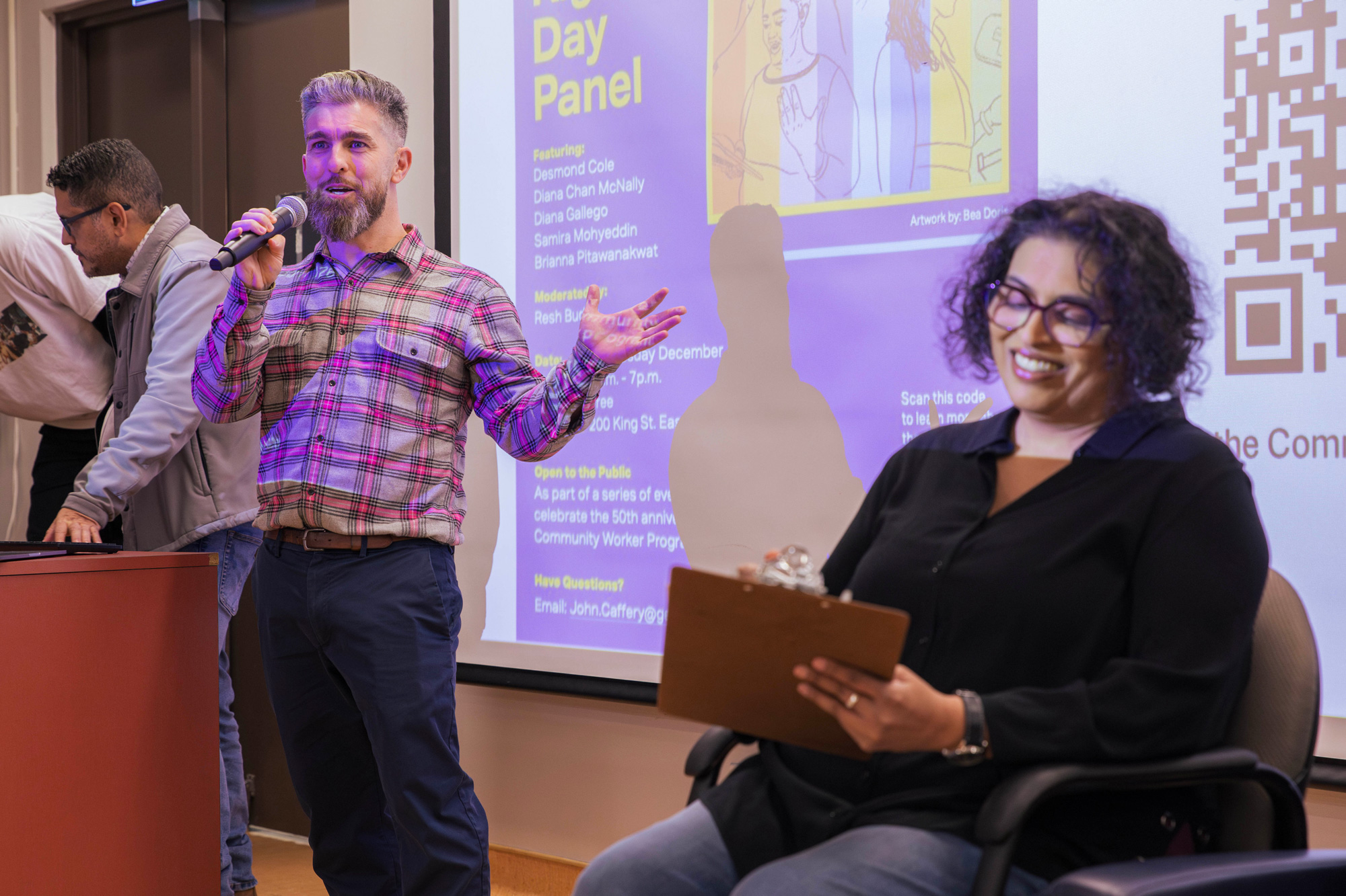 Faculty member, John Caffrey, welcomes guests to the Human Rights Day panel