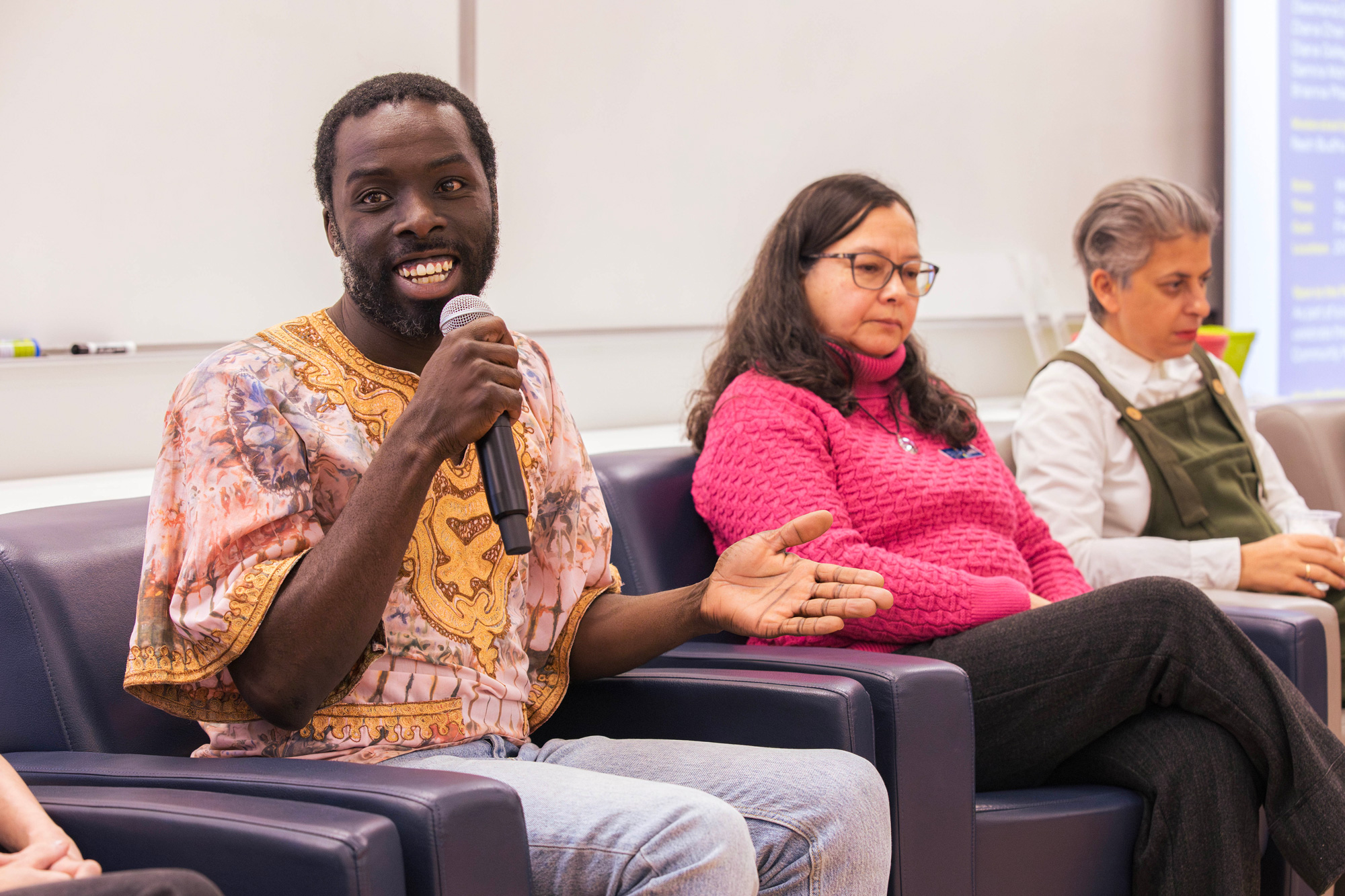 A panelist speaks to the audience at the Human Rights Day event