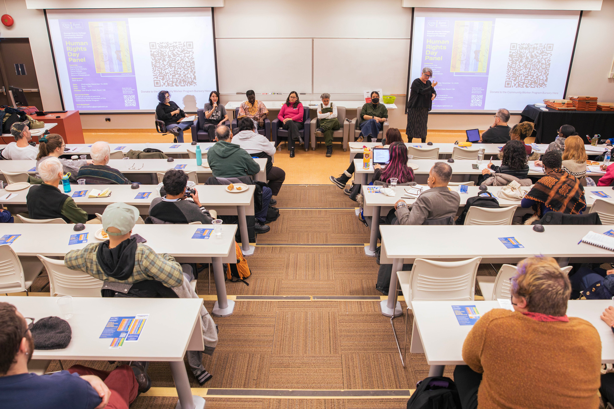 Guests in the audience listen to panelists at the Human Rights Day panel
