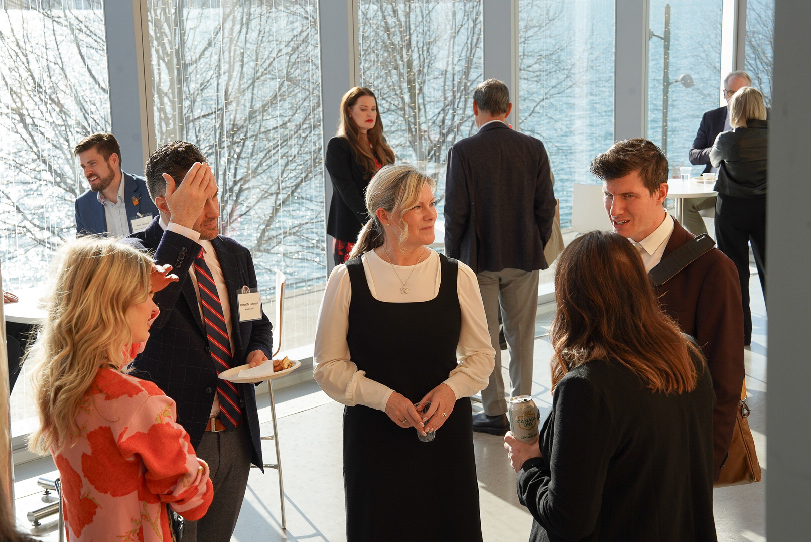 Attendees network at the OBAC fireside chat at Waterfront campus