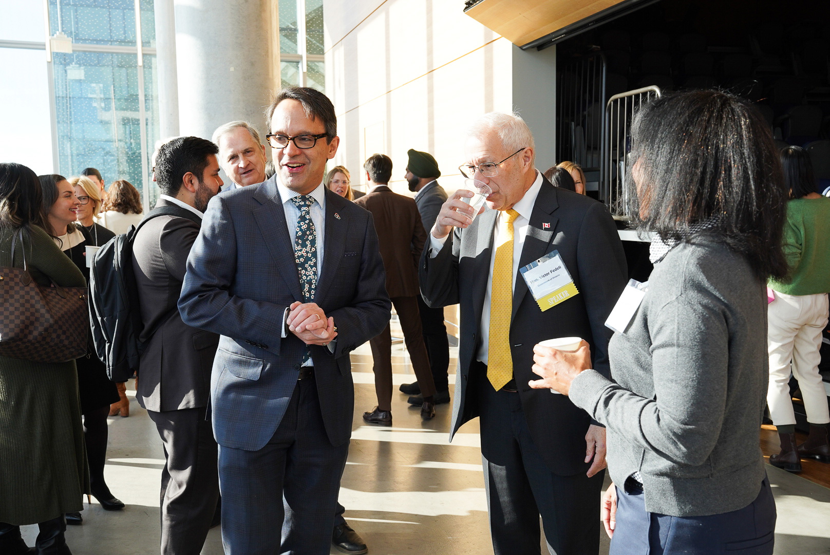 Attendees network at the OBAC fireside chat at Waterfront campus