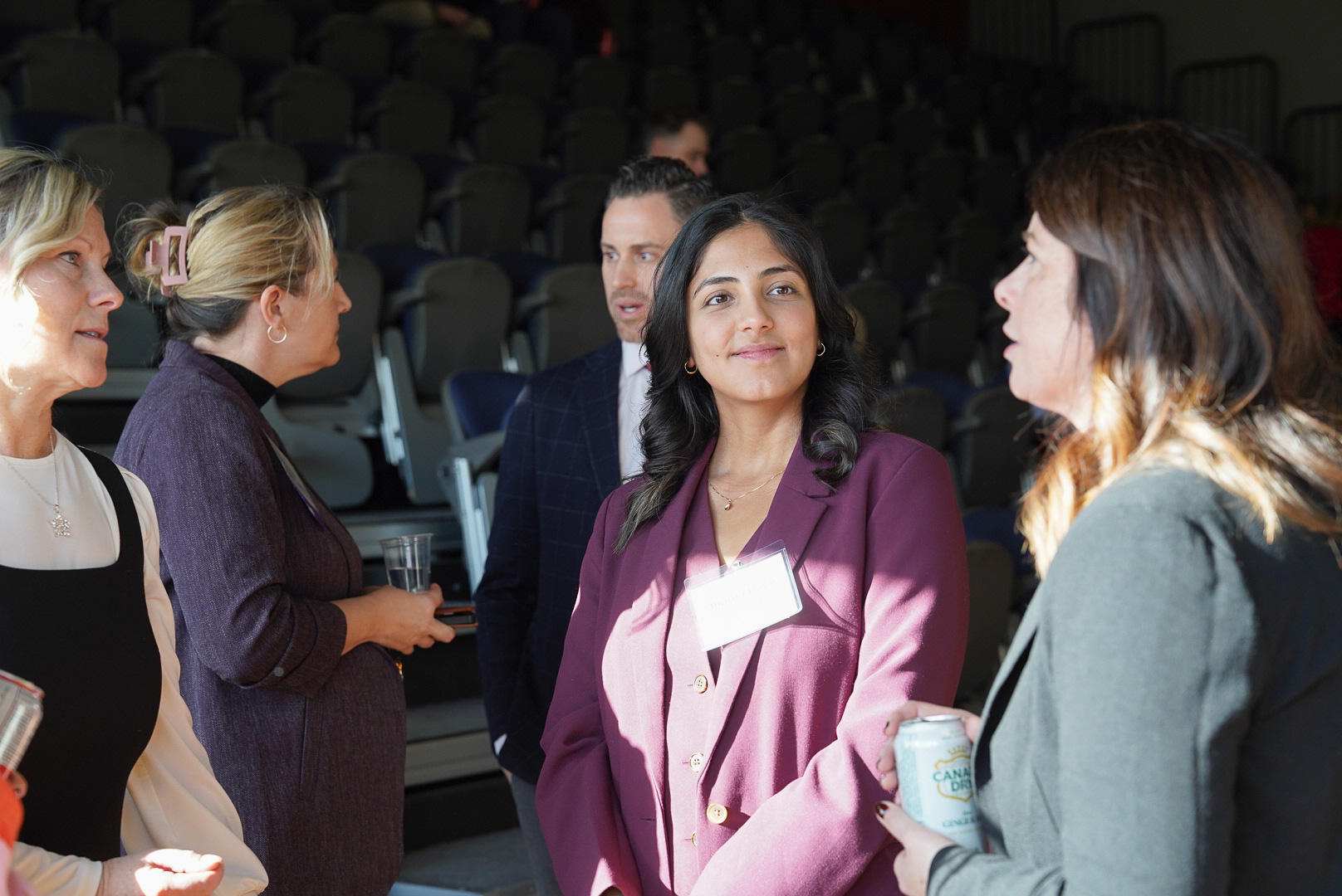Attendees network at the OBAC fireside chat at Waterfront campus