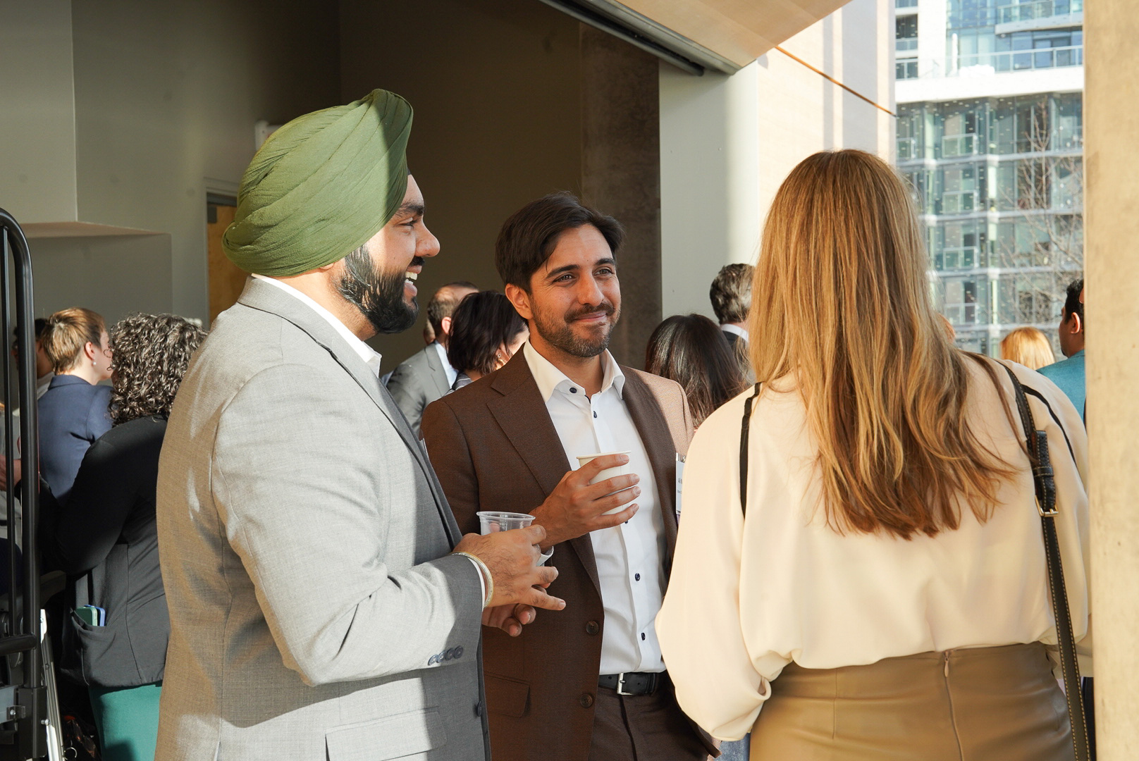 Attendees network at the OBAC fireside chat at Waterfront campus