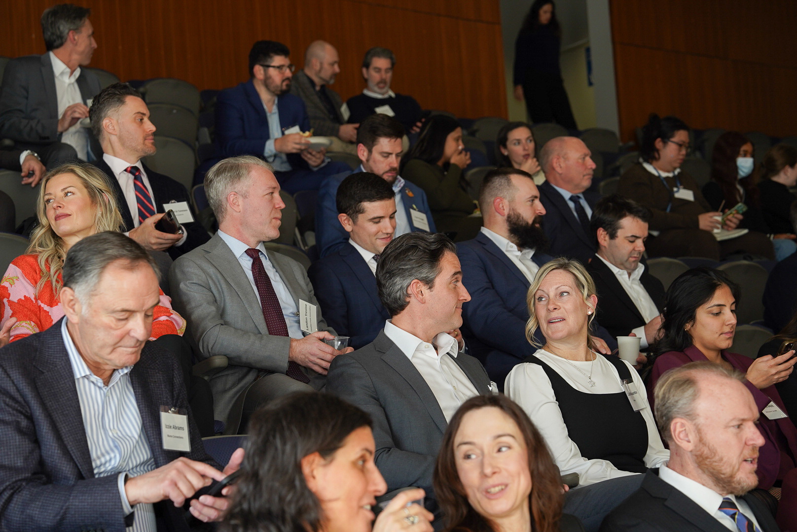 Attendees network at the OBAC fireside chat at Waterfront campus