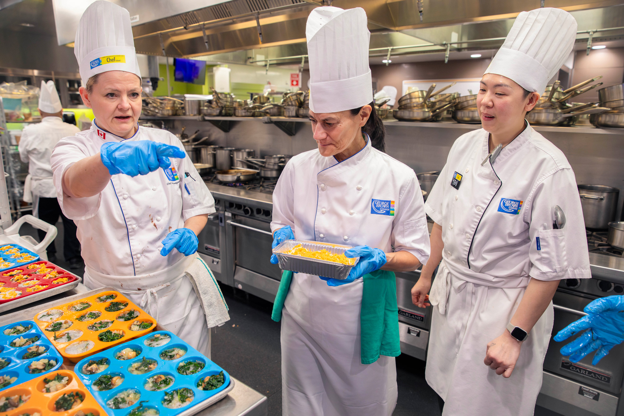 Chef faculty and senior leaders prepare holiday meals