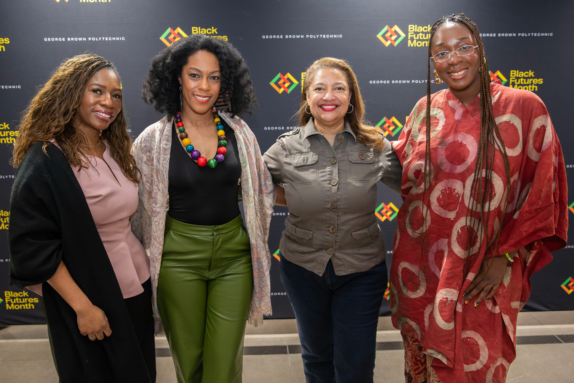 George Brown staff and students pose for a photo with guest poet Tracy J