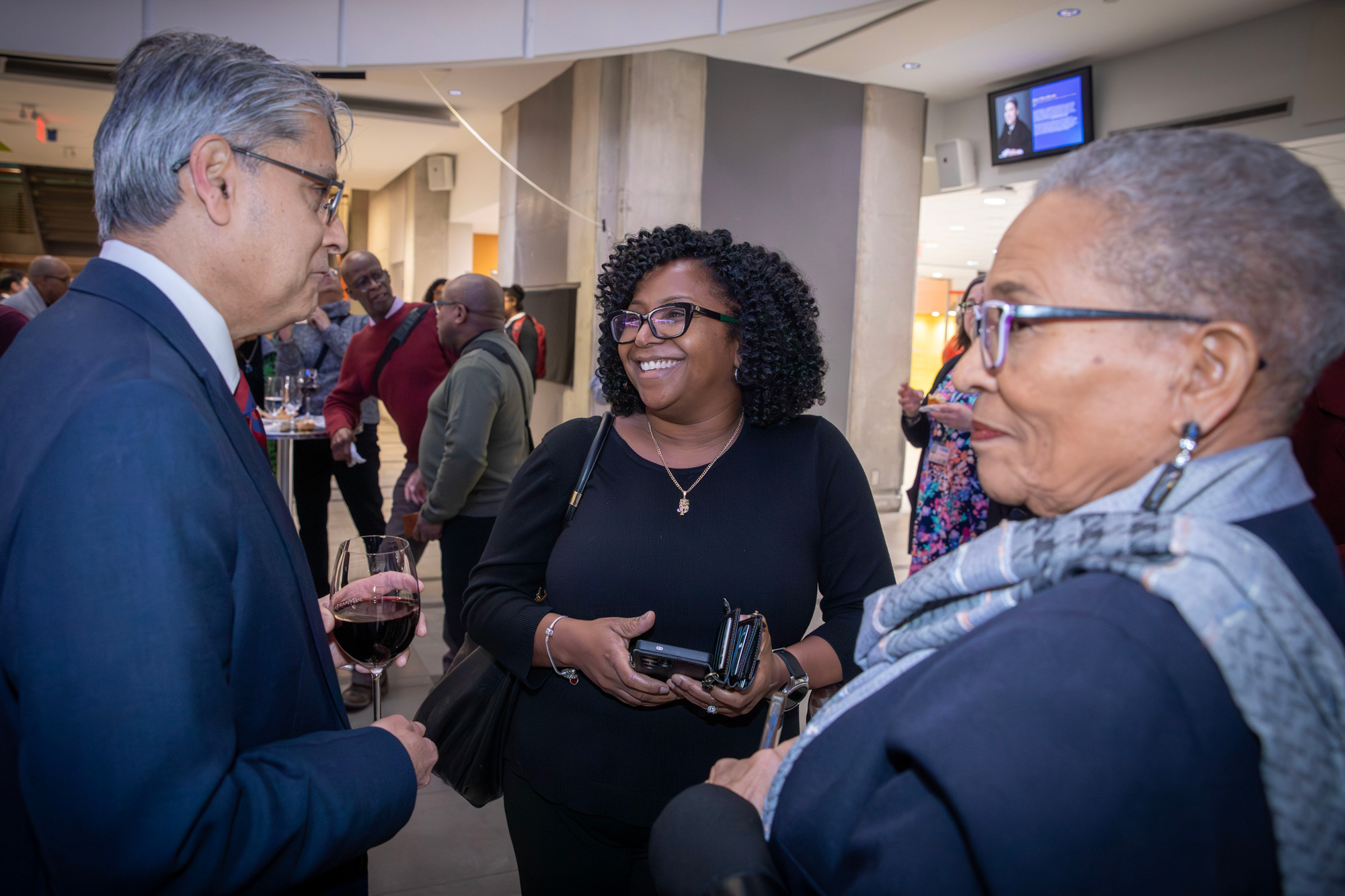 Dr. Hassun Malik chats with guests at the Hubbard Atrium naming event