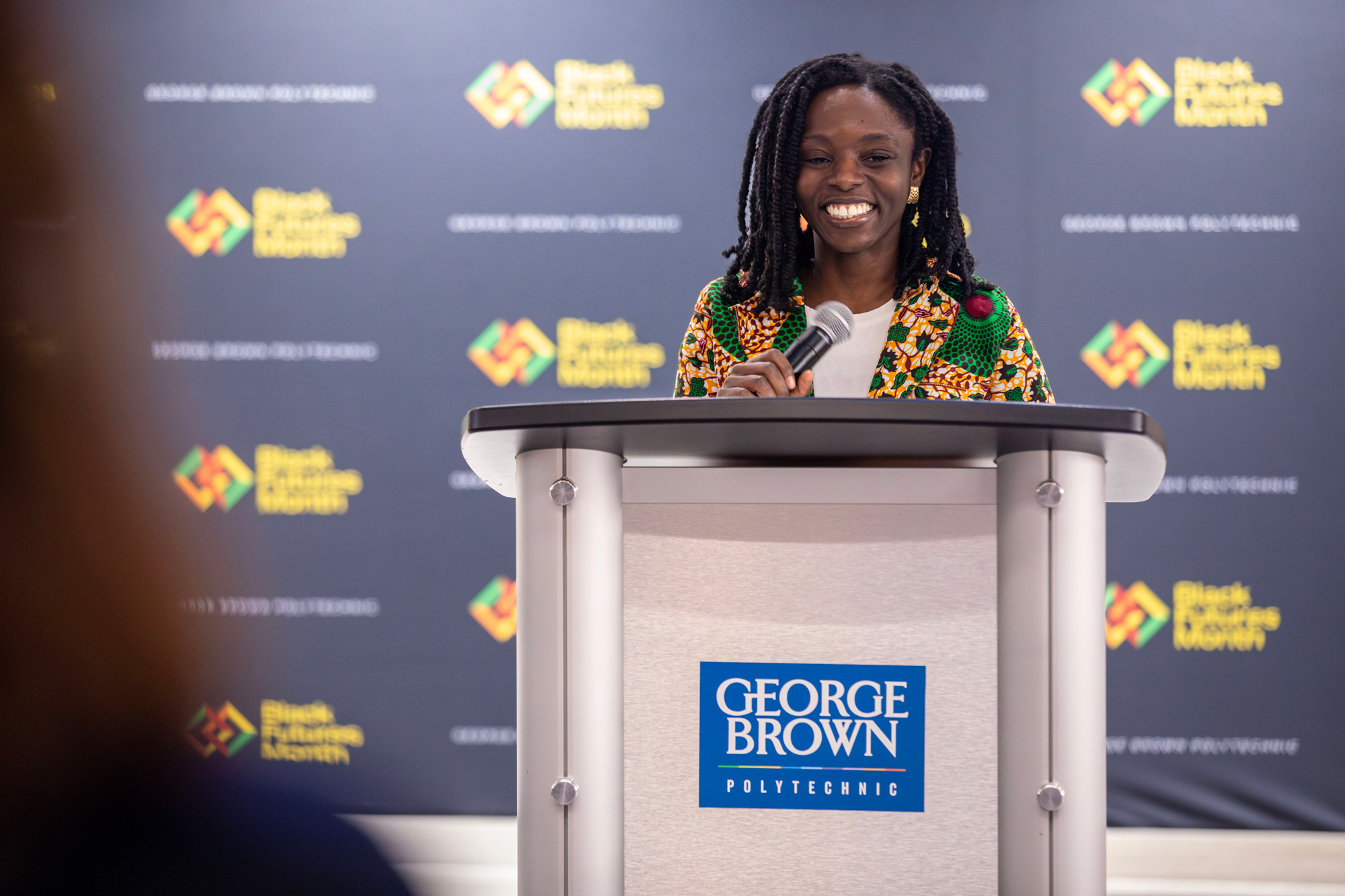 A George Brown student speaks at the podium at the Hubbard naming event