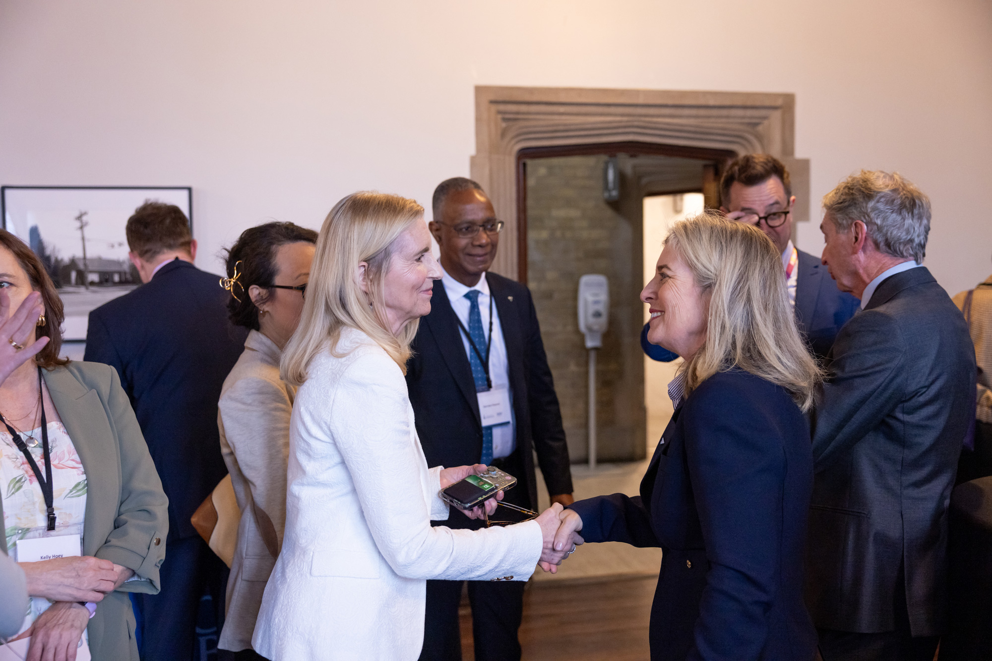 Education and industry leaders chat the signing event