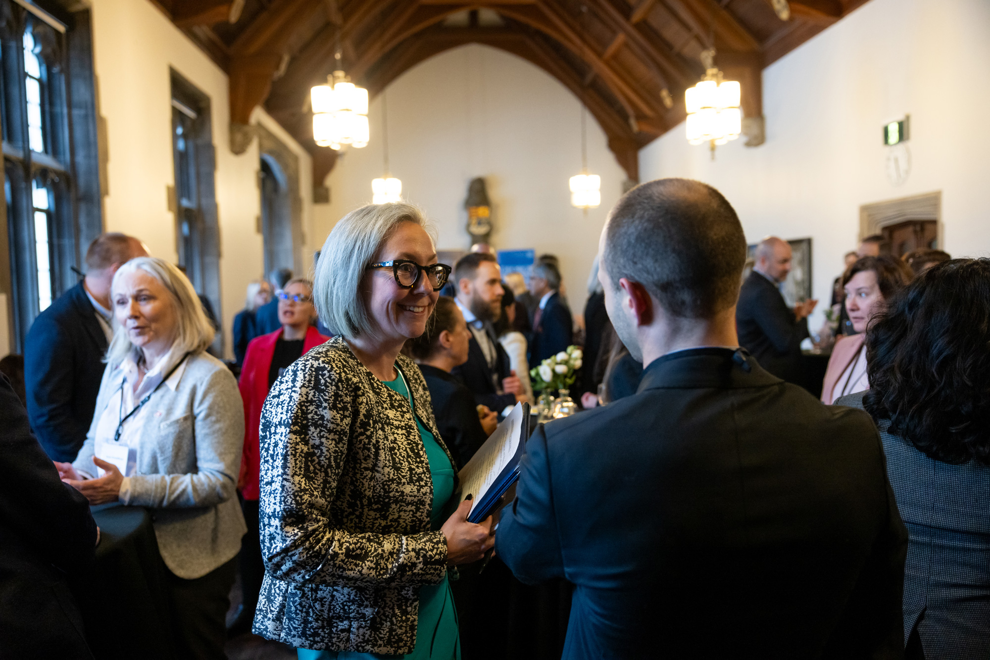 Education and industry leaders chat the signing event