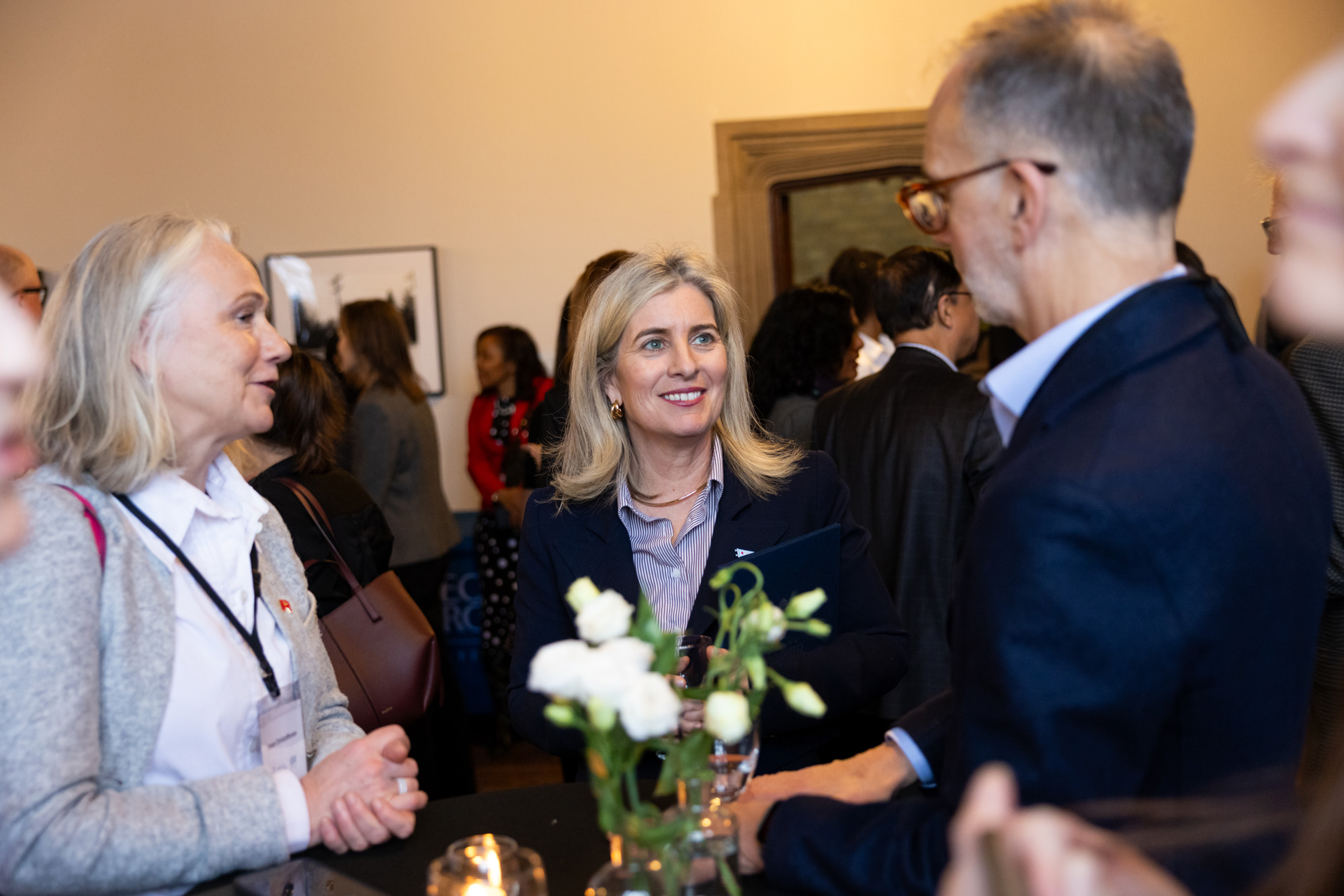 Education and industry leaders chat the signing event at U o fT