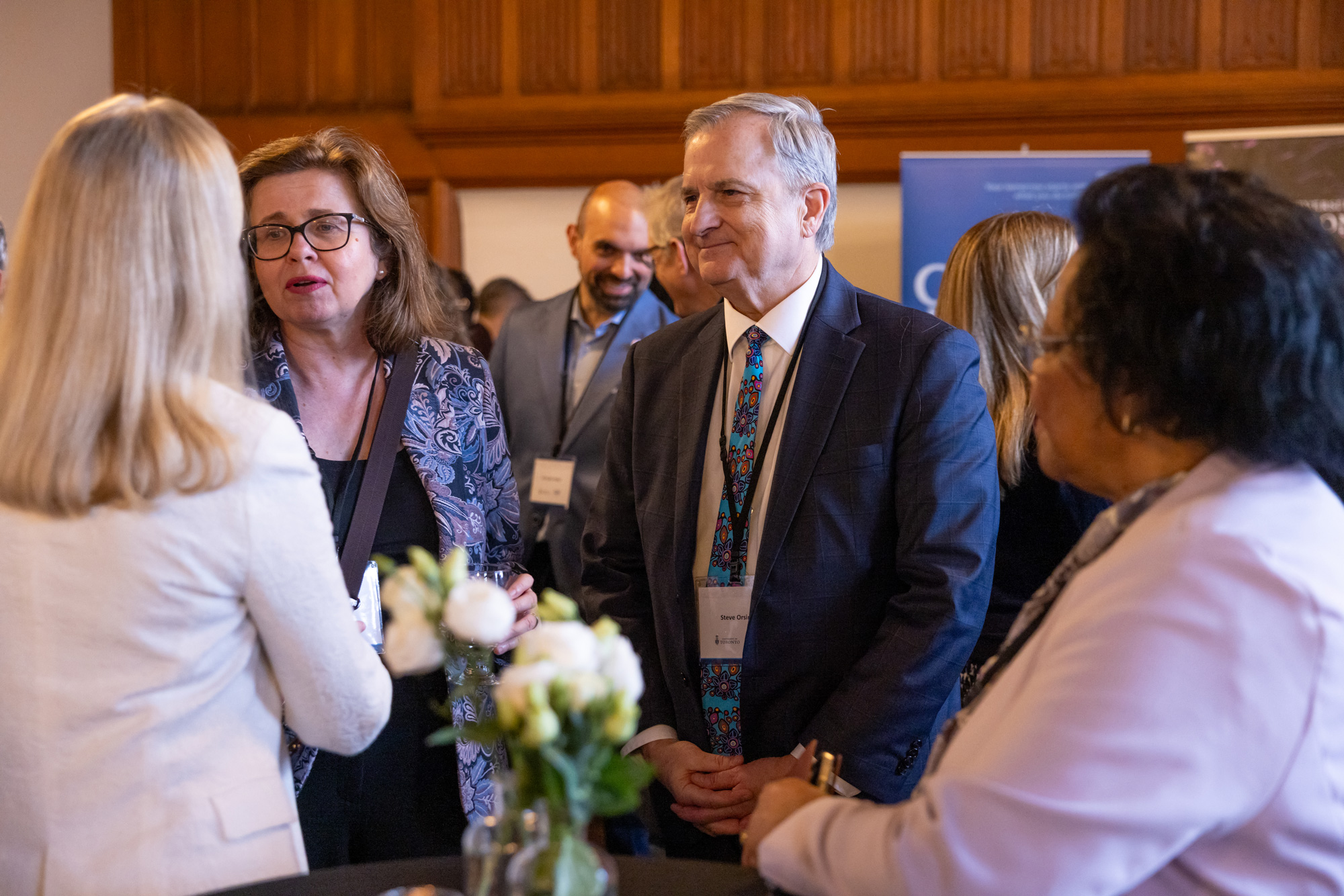 Education and industry leaders chat the signing event