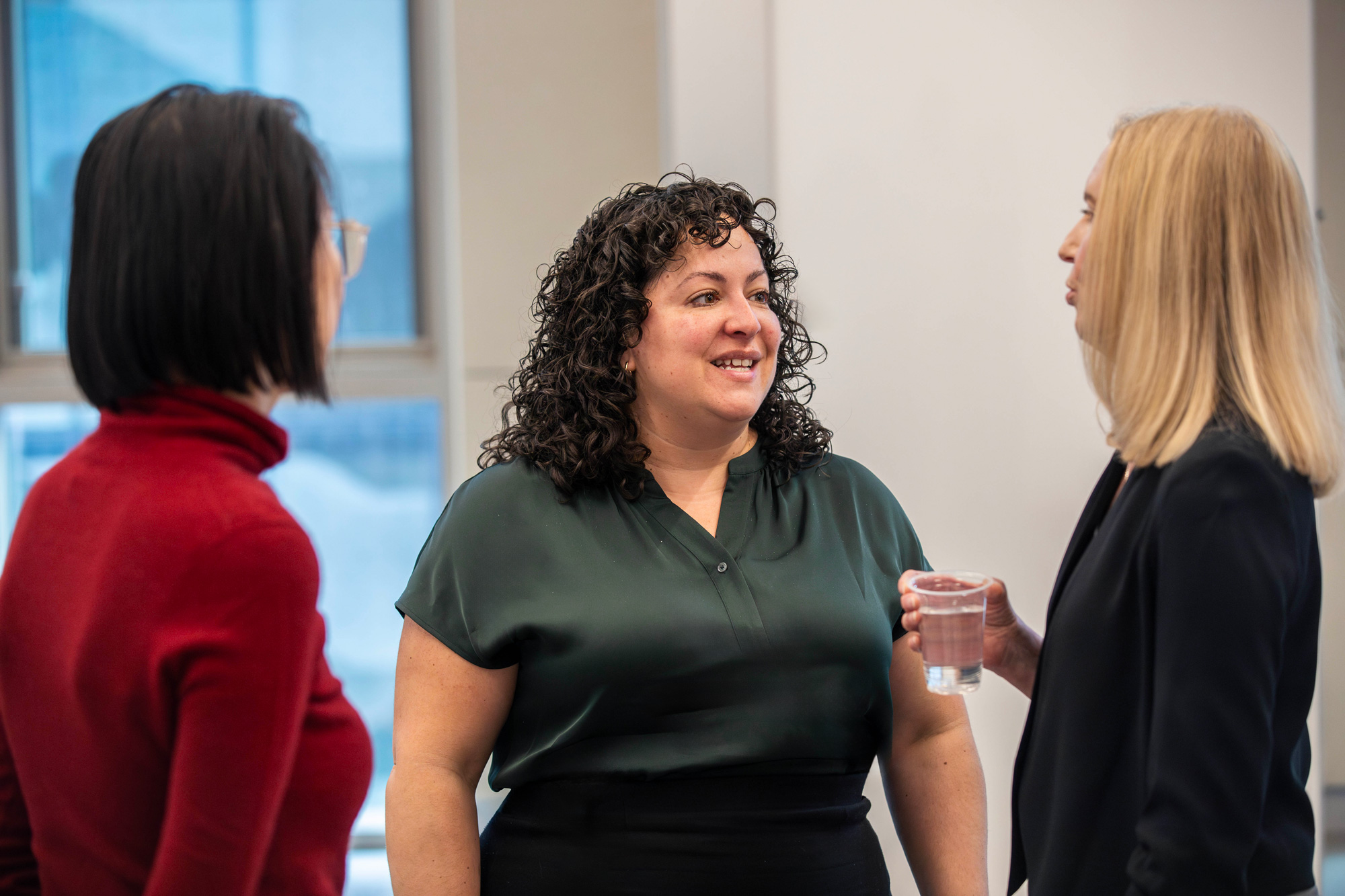 AI Innovation Showcase guests chat at the event