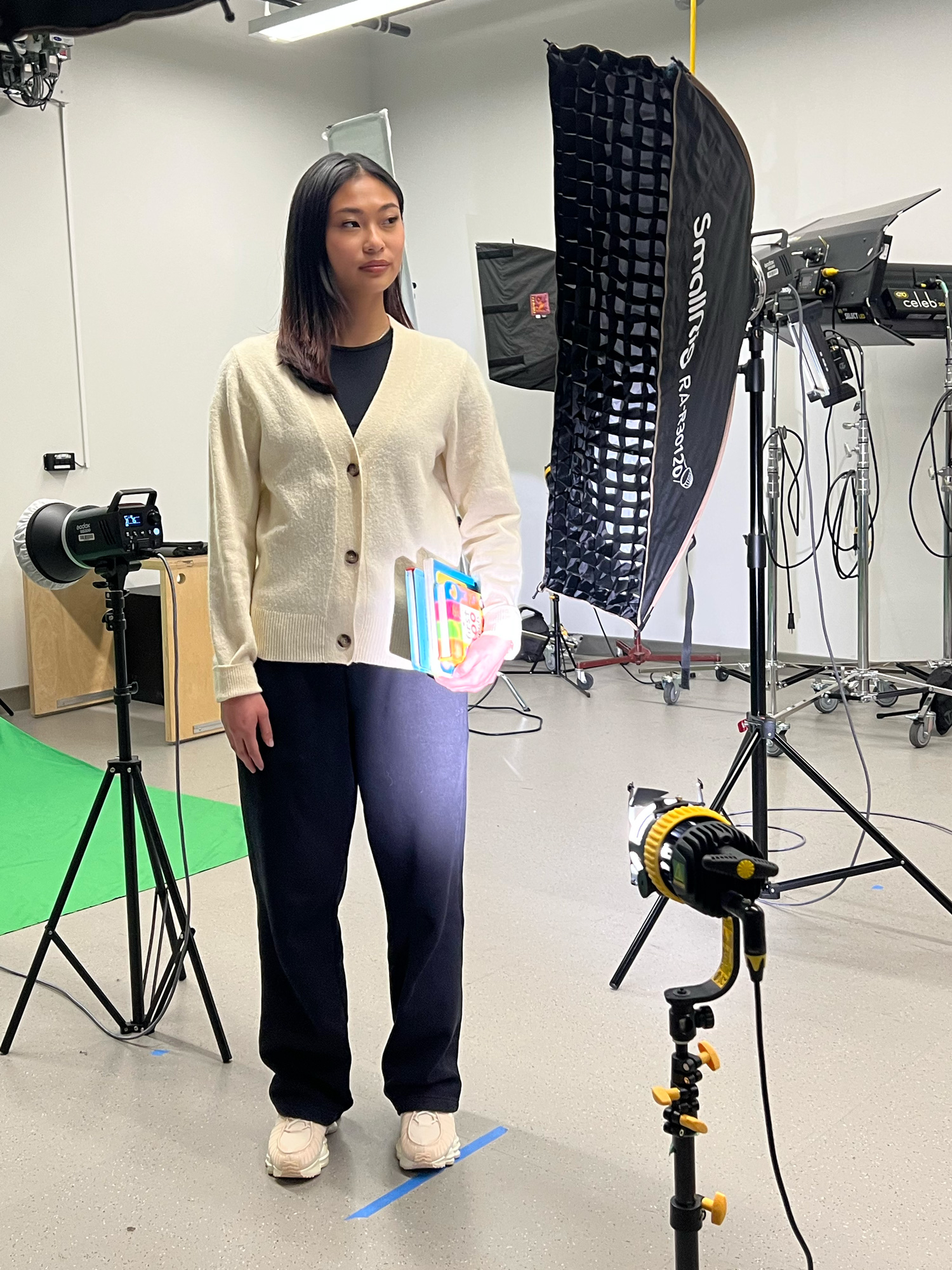 A behind the scenes look at a student posing for the new OWN campaign images