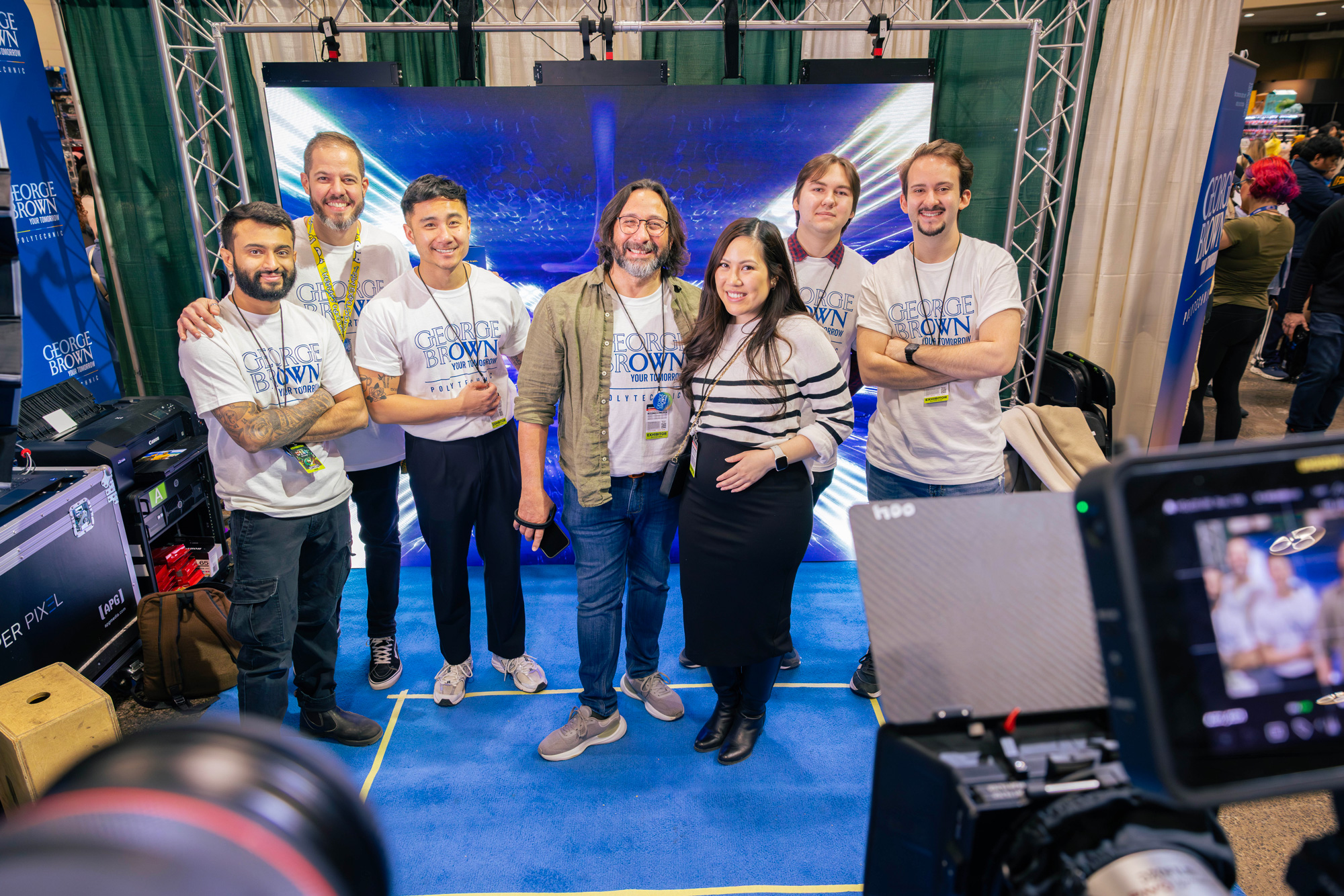 Faculty and staff pose at George Brown's booth at the 2026 Comicon event