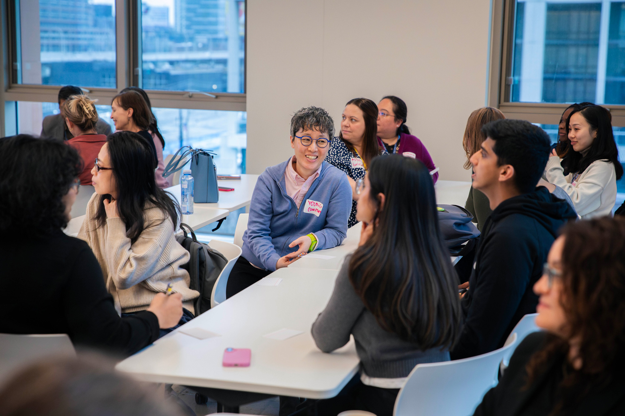 Participants at the Mental Health Conference chat during breakout sessions