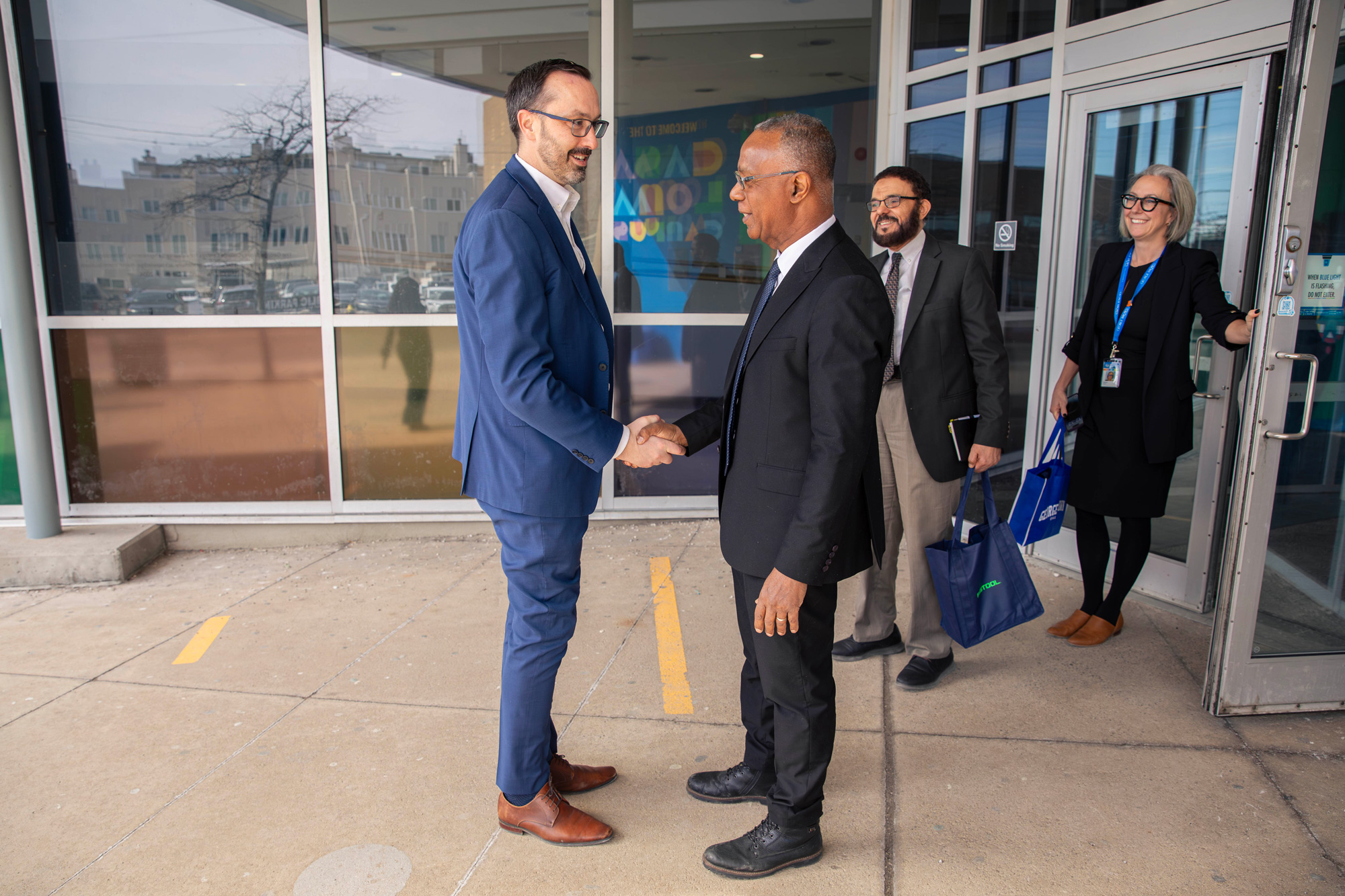 Minister Quinn visits Casa Loma and is greeted at the entrance by Dr. Gervan Fearon