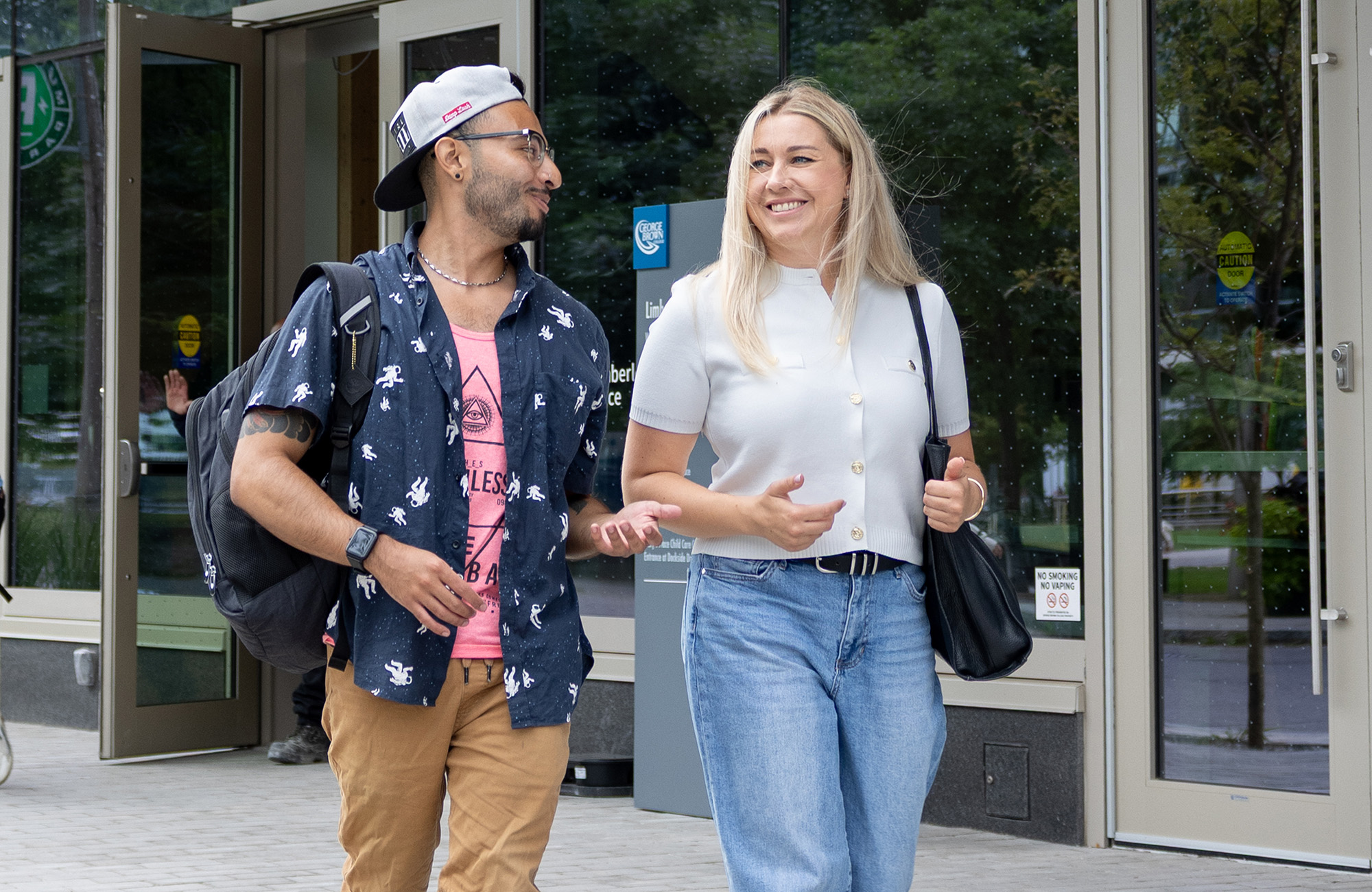 Two students walking in front of the Limberlost building