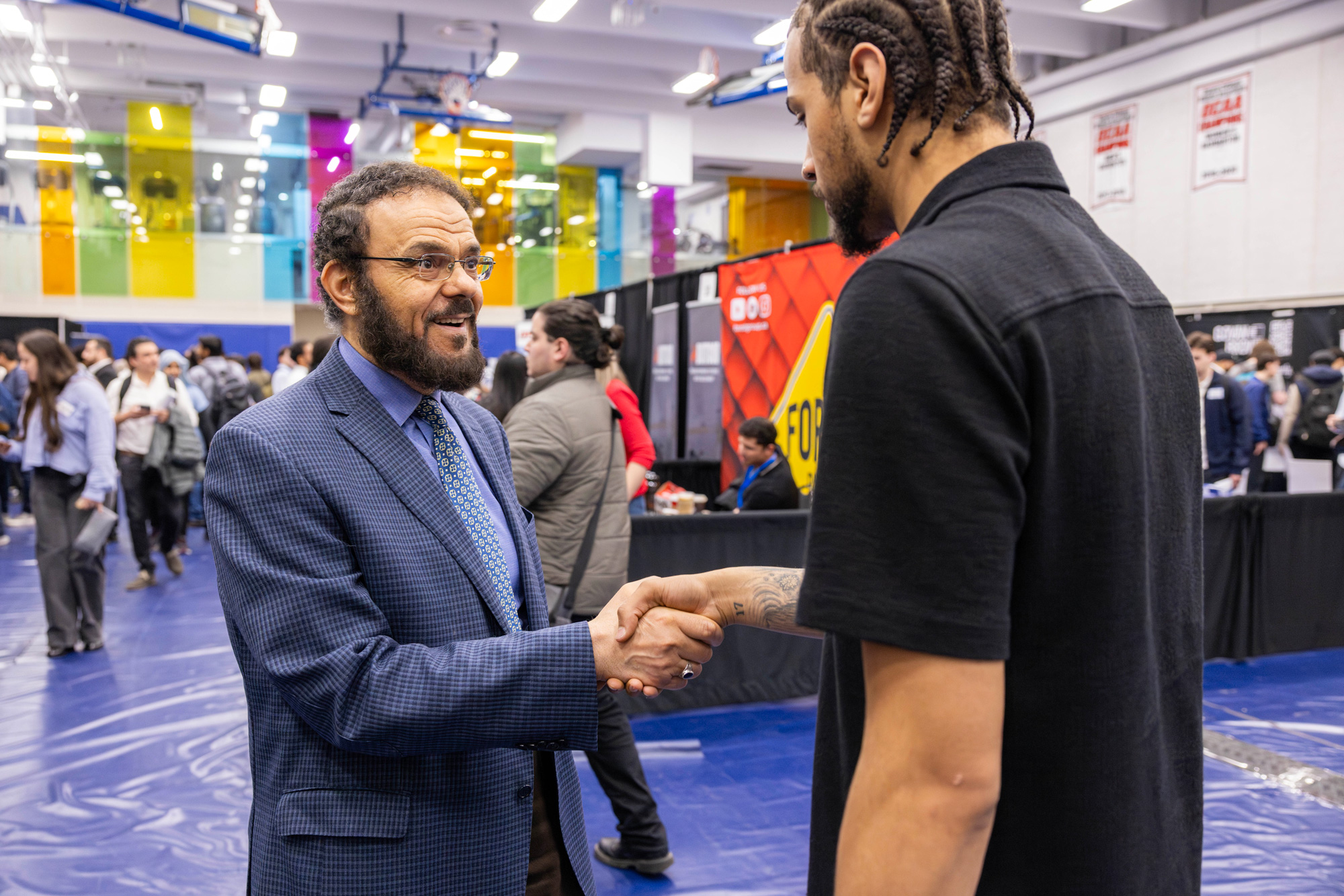Dean Adel Esayed chats with a student at the career fair