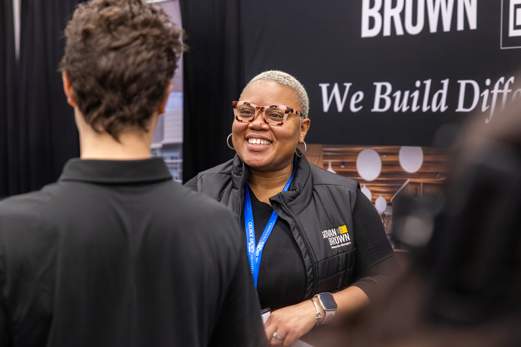 An employer chats with students at the Casa Loma career fair