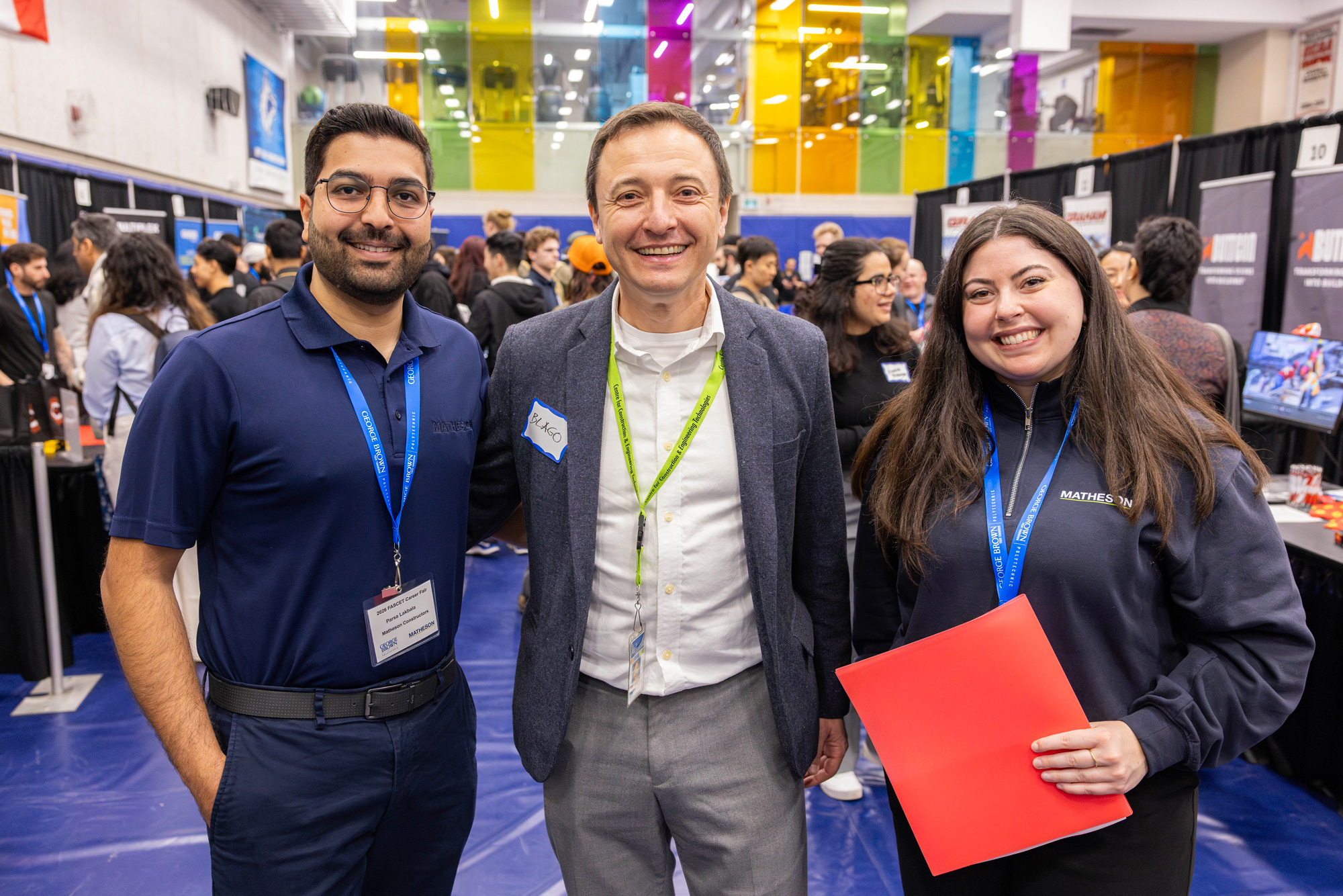 Faculty chat with alumni at the career fairs